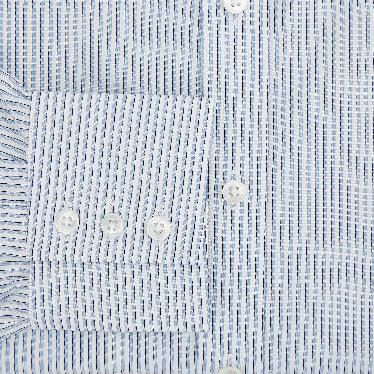 Image 4 of product The Turnbull & Asser Sky Blue Shadow Pinstripe Mayfair Shirt, a long-sleeved, button-up shirt with a T&A collar and light blue and white thin vertical stripes, is displayed flat on a white background.