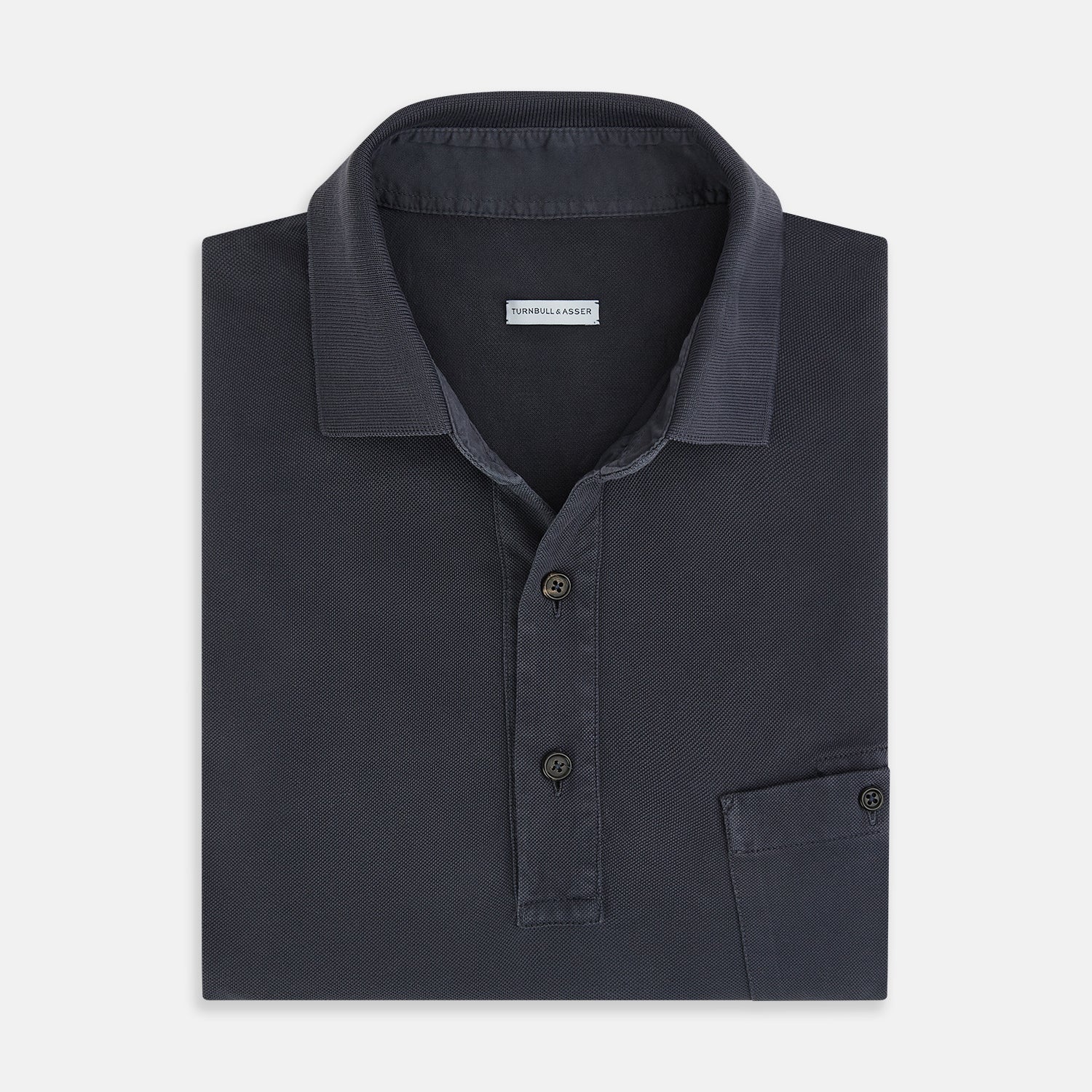 Image 4 of product The Turnbull & Asser Charcoal Polo Shirt is a short-sleeve, soft cotton jersey top with a collar, three-button placket, and a left chest pocket, shown on a plain white background.