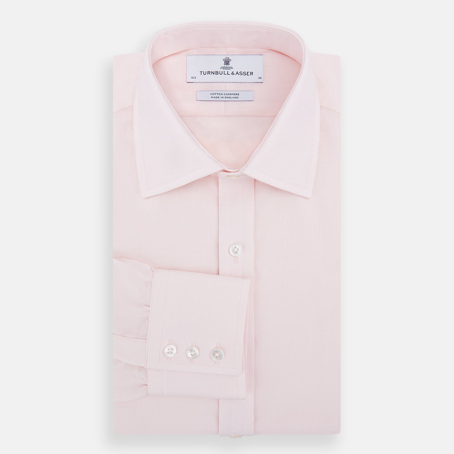Image 5 of product The Pale Pink Cotton Cashmere Mayfair Shirt by Turnbull & Asser features a classic collar, button-down front, and buttoned cuffs, crafted from a luxurious cotton-cashmere blend and displayed flat on a white background.