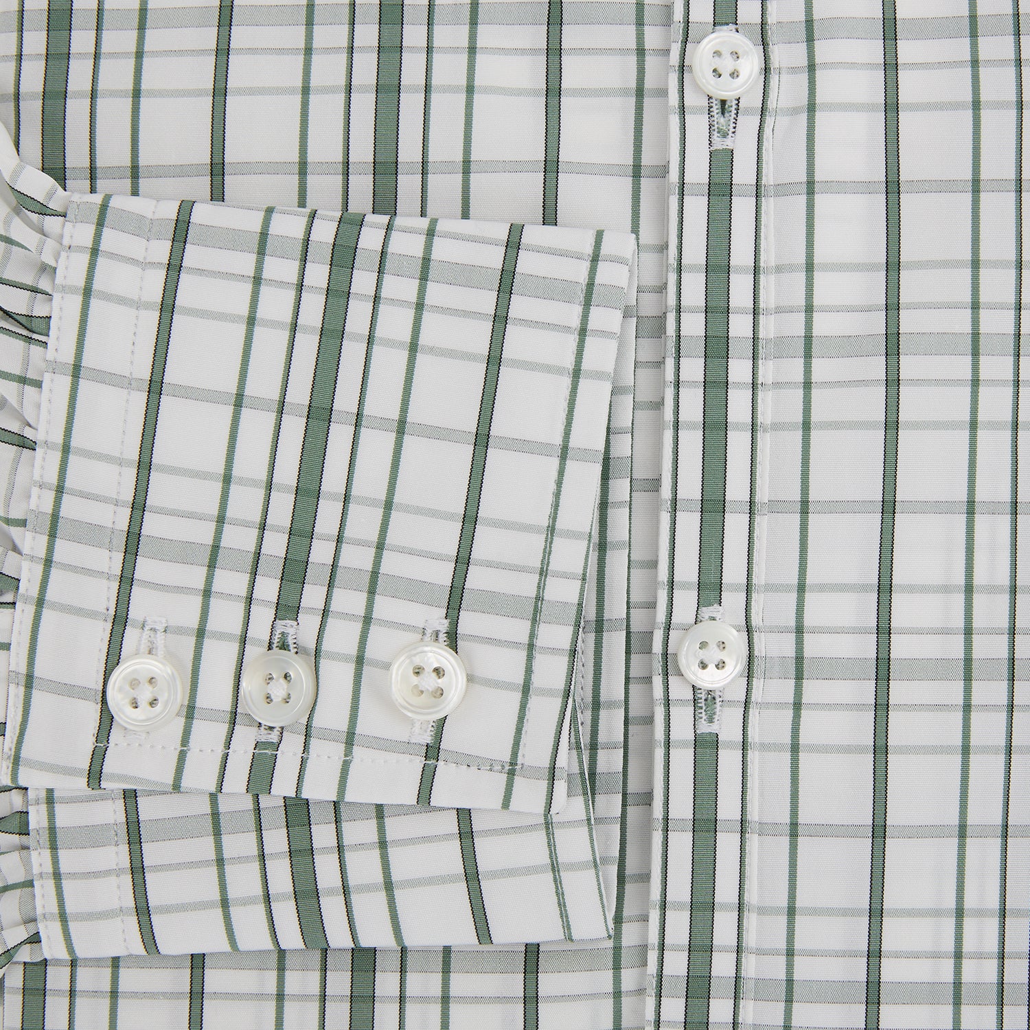 Image 4 of product The Turnbull & Asser Sage Green Plaid Check Westminster Shirt features a collared, long-sleeve button-up design with a white base and sage green plaid pattern, showcasing classic British craftsmanship against a clean white background.