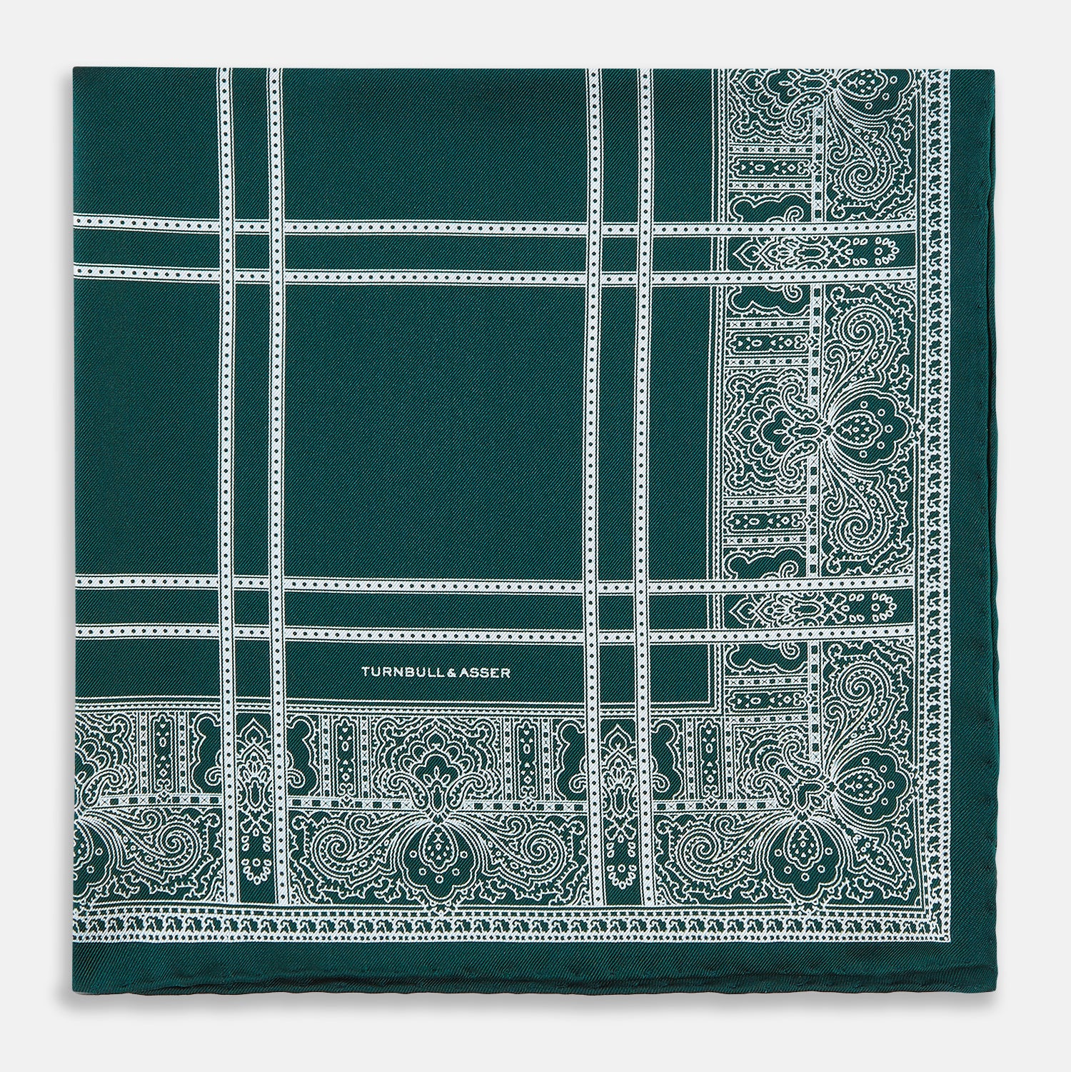 Image 3 of product Turnbull & Asser’s Forest Green Paisley Bandana Patterned Silk Pocket Square is handcrafted in England, featuring an intricate white geometric and paisley design with the brand name printed in one corner.