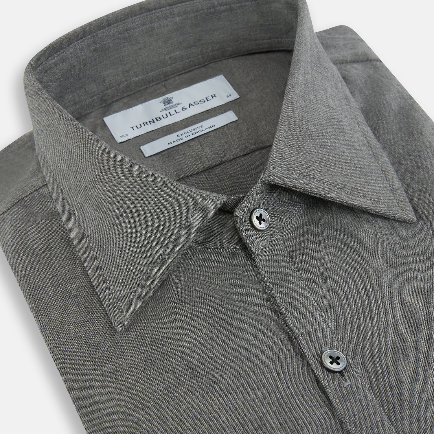 Image 2 of product The Pale Charcoal Westminster Shirt by Turnbull & Asser features British craftsmanship with a tailored silhouette, long sleeves, pointed collar, buttoned cuffs, and a solid pale charcoal hue, elegantly shown against a white background.