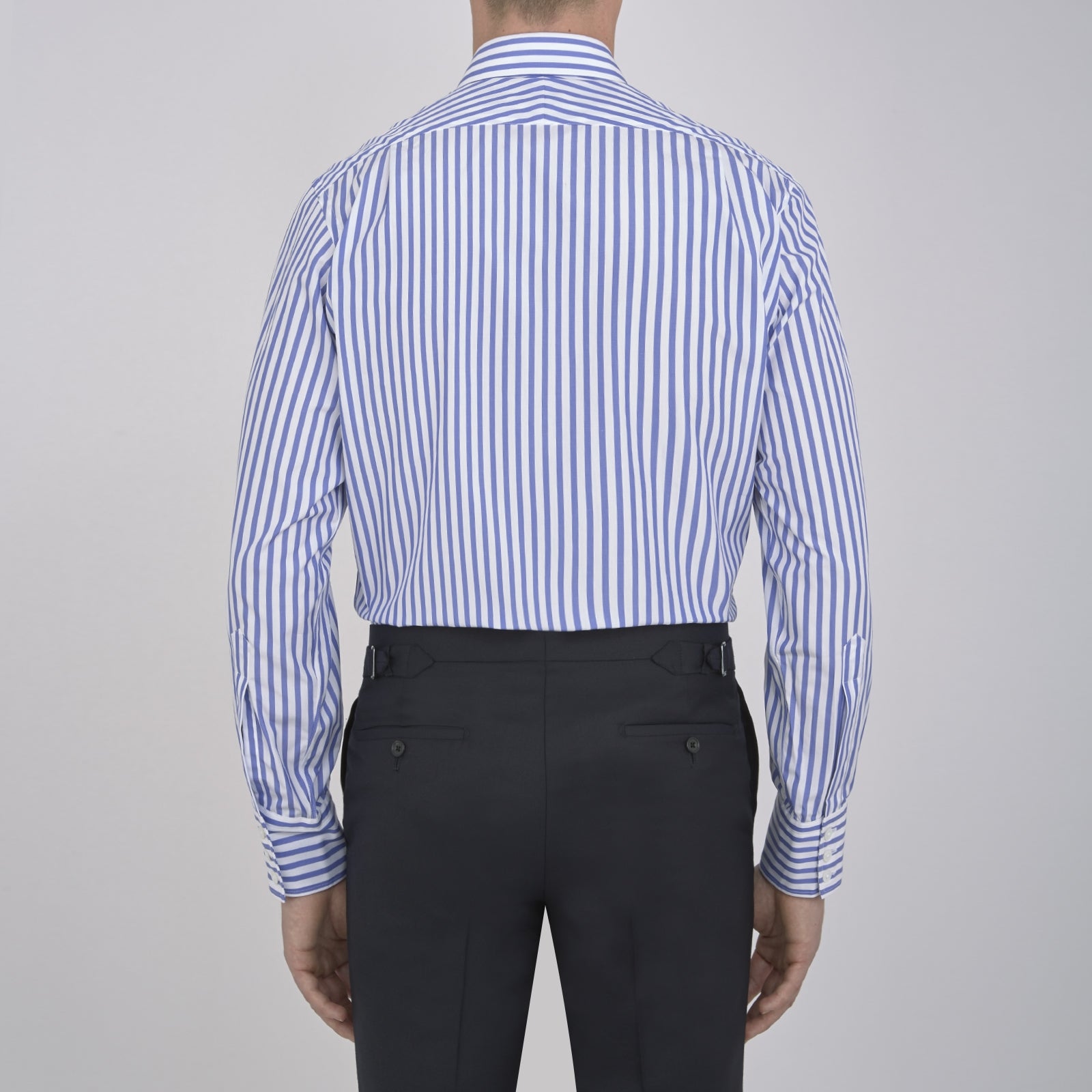 Image 5 of product The Turnbull & Asser Blue and White Candy Stripe Shirt features a T&A collar and 3-button cuffs, shown neatly folded on a plain white background.