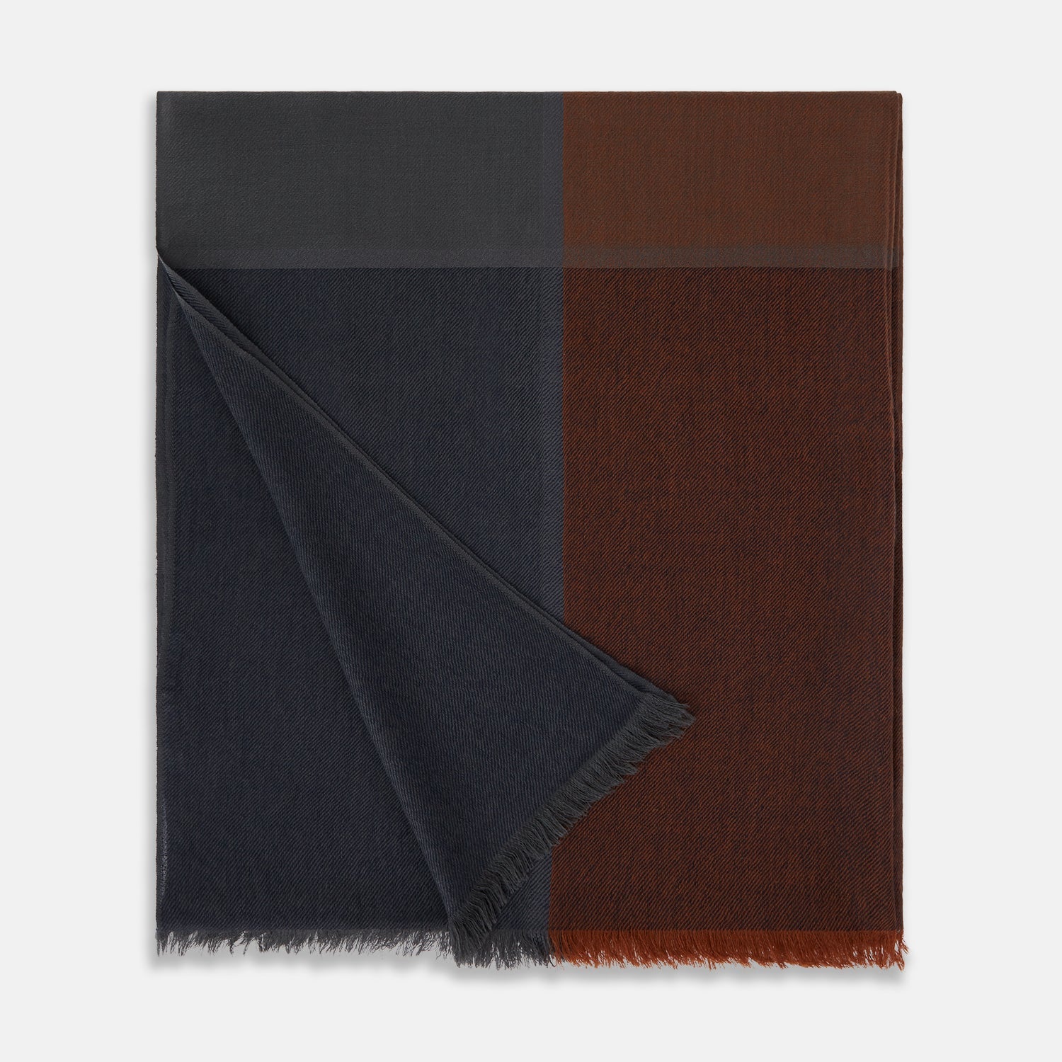 Image 3 of product The Turnbull & Asser Brown and Navy Cashmere Scarf features a long, rectangular shape, color block design, soft texture, and lightly frayed edges, elegantly folded on a plain white background.