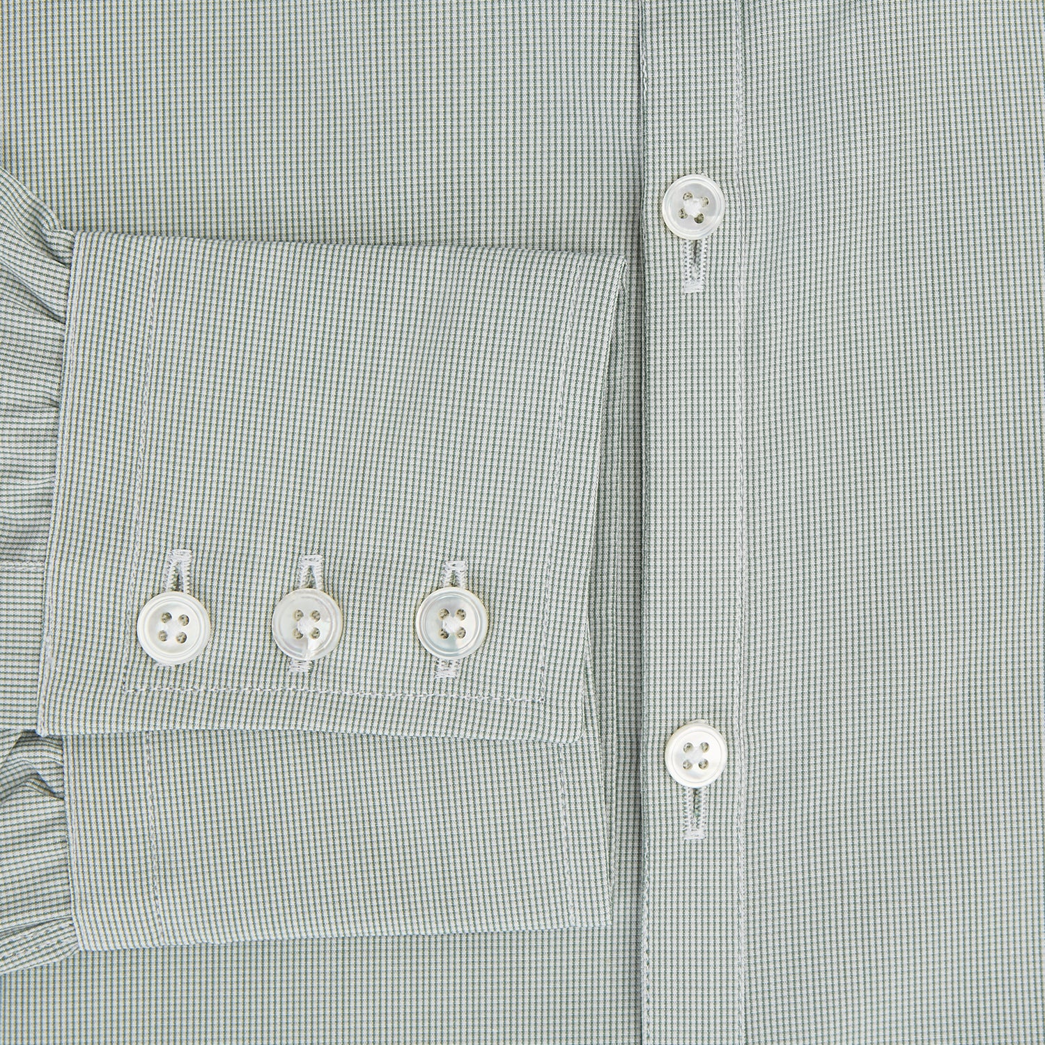 Image 4 of product A dark green micro graph check Westminster shirt by Turnbull & Asser, featuring fine British craftsmanship, a Turnbull collar, and white buttons, is laid flat on a white background.