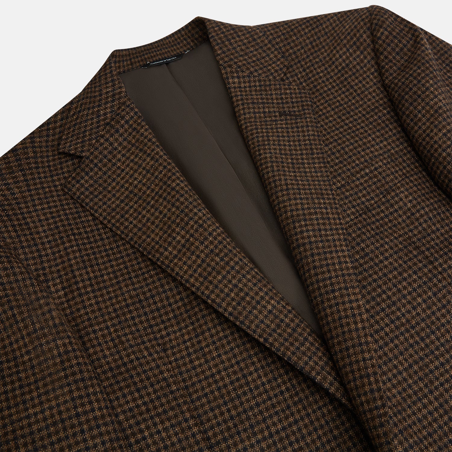 Image 2 of product The Turnbull & Asser Brown Gingham Check Sports Jacket features a single button closure, notched lapels, and two front flap pockets, shown against a plain white background.