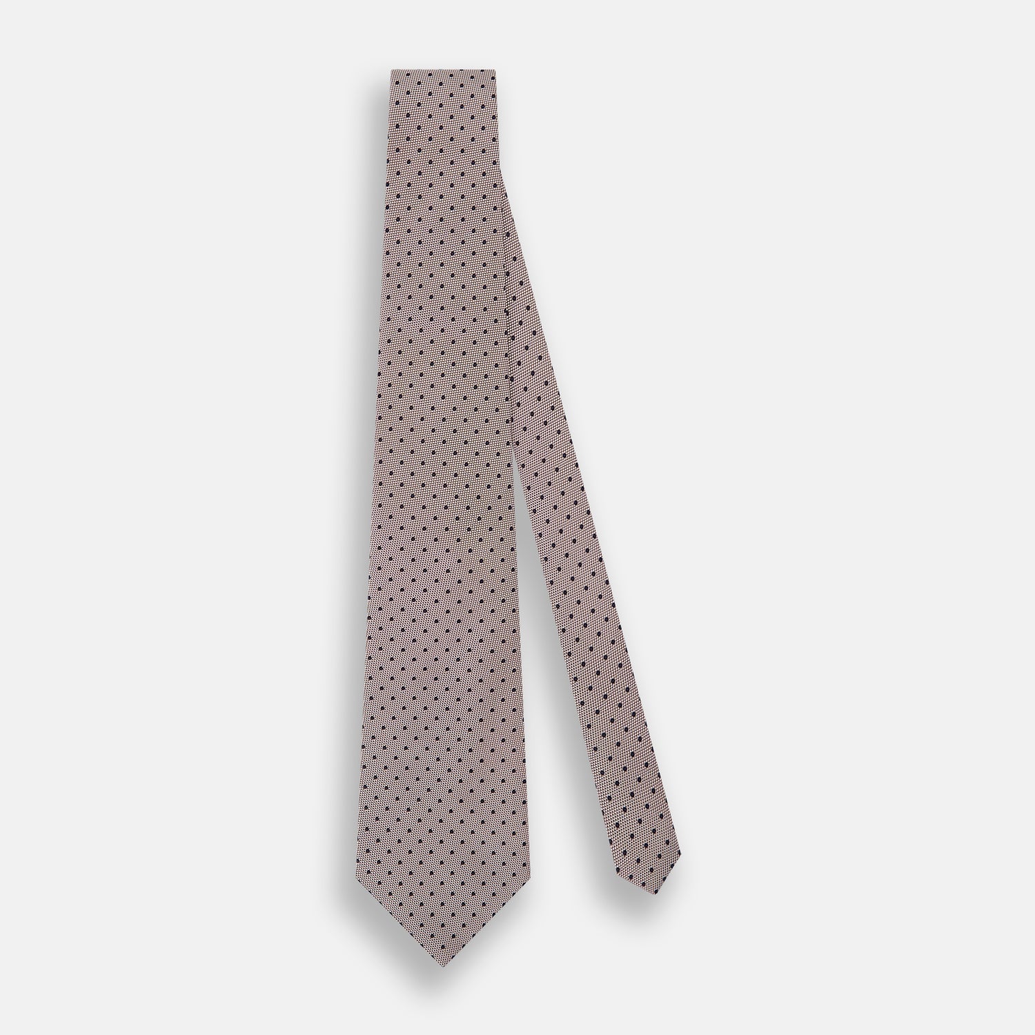 Image 2 of product The Turnbull & Asser Navy and Lilac Micro Dot Silk Tie, featuring subtle micro dots, is the perfect refined accessory for smart outfits, shown rolled up against a plain white background.