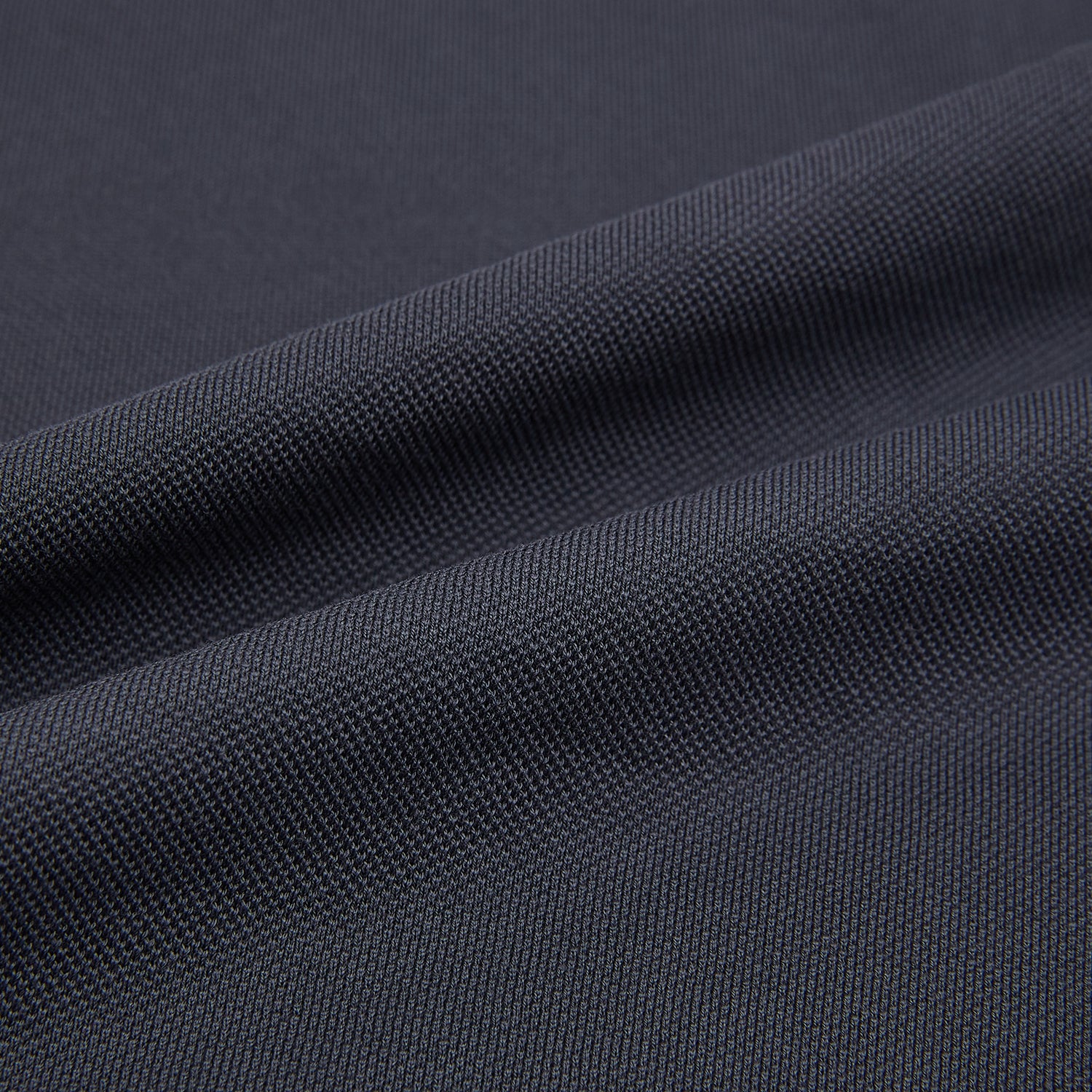 Image 5 of product The Turnbull & Asser Charcoal Polo Shirt is a short-sleeve, soft cotton jersey top with a collar, three-button placket, and a left chest pocket, shown on a plain white background.
