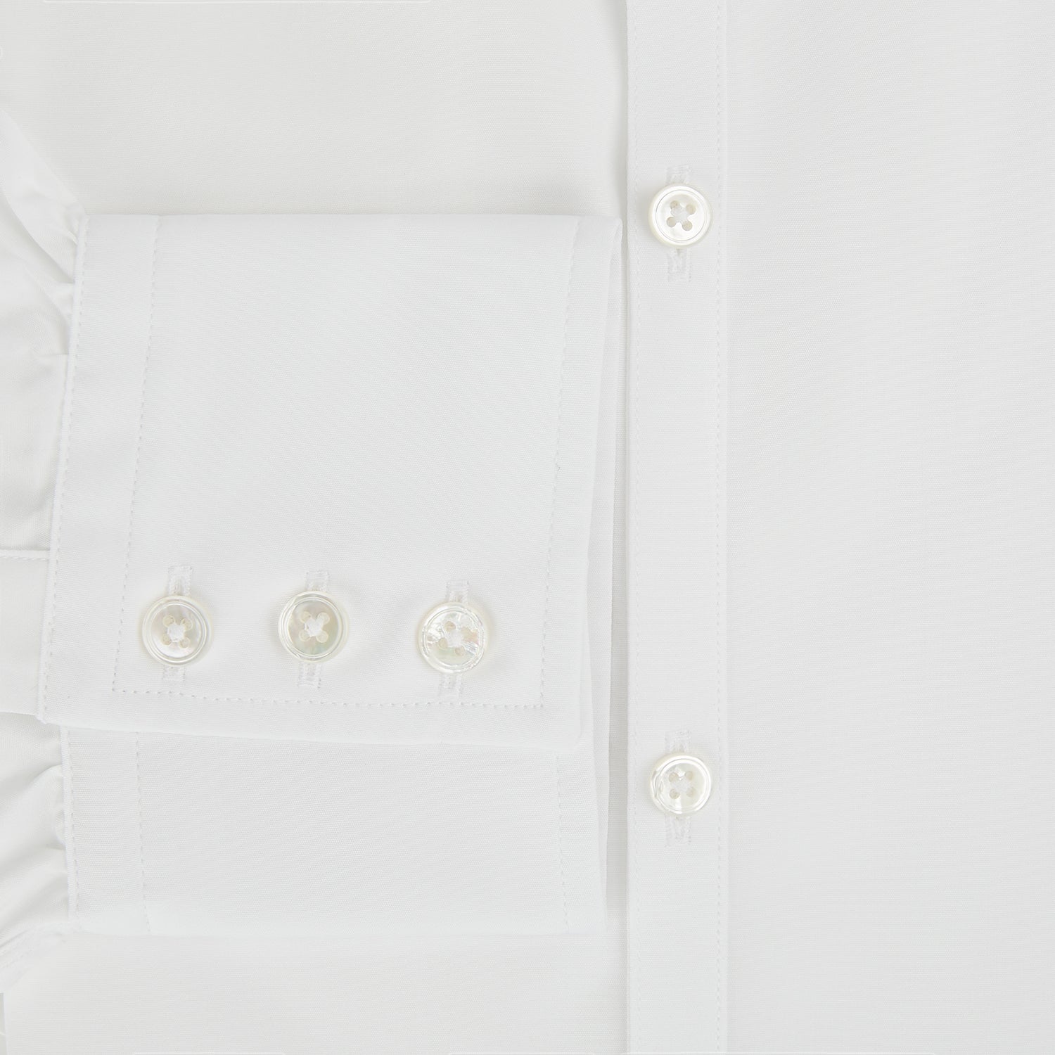 Image 4 of product The PLAIN WHITE WESTMINSTER SHIRT WITH TURNBULL COLLAR AND 3-BUTTON CUFFS by Turnbull & Asser features refined British craftsmanship, long sleeves, a straight hem, and a crisp white design displayed on a plain background.