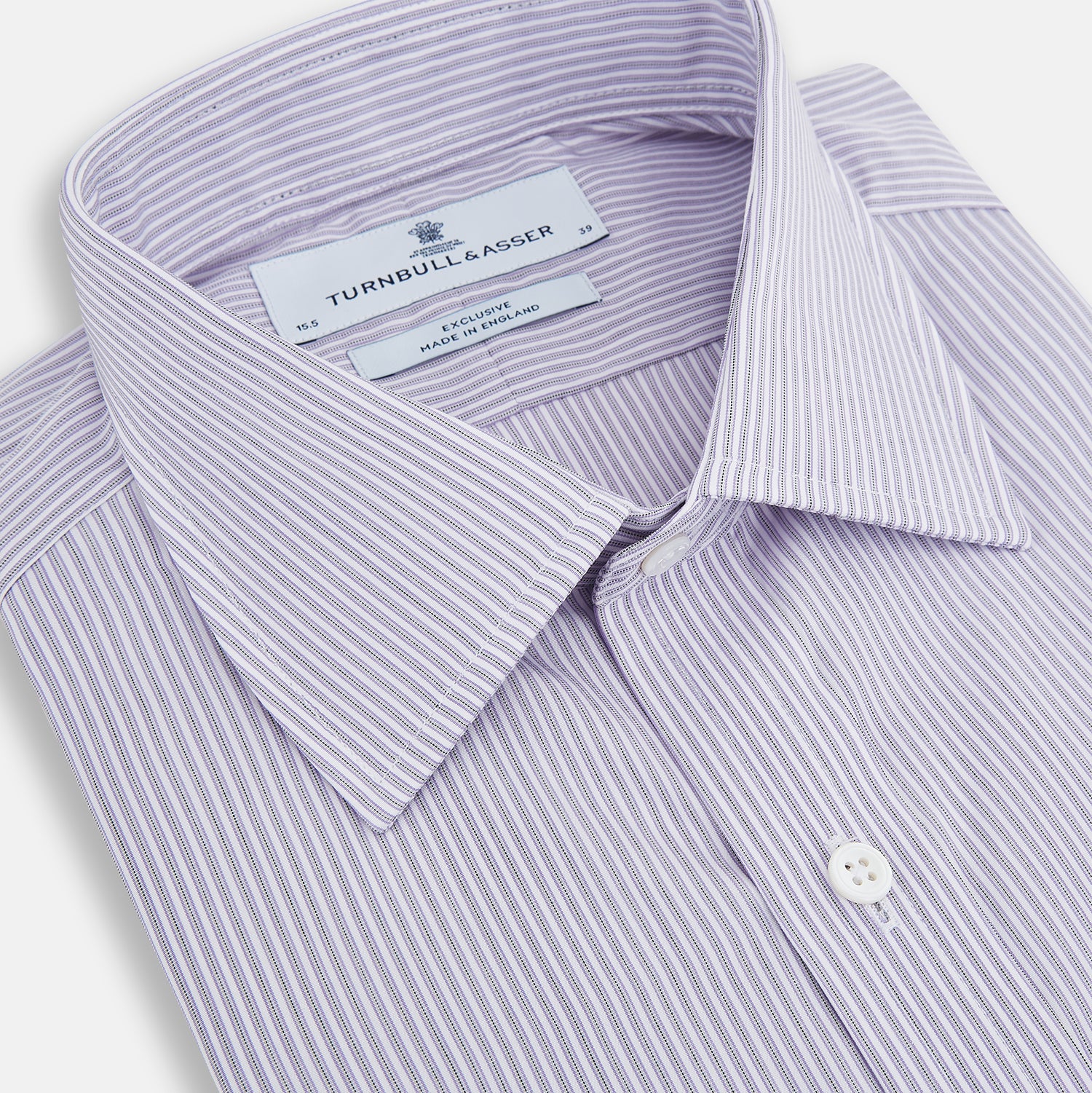 Image 2 of product The Lilac Halo Stripe Mayfair Shirt by Turnbull & Asser features a relaxed Mayfair fit, white buttons, a pointed collar, and a subtle lilac stripe pattern for timeless sophistication.