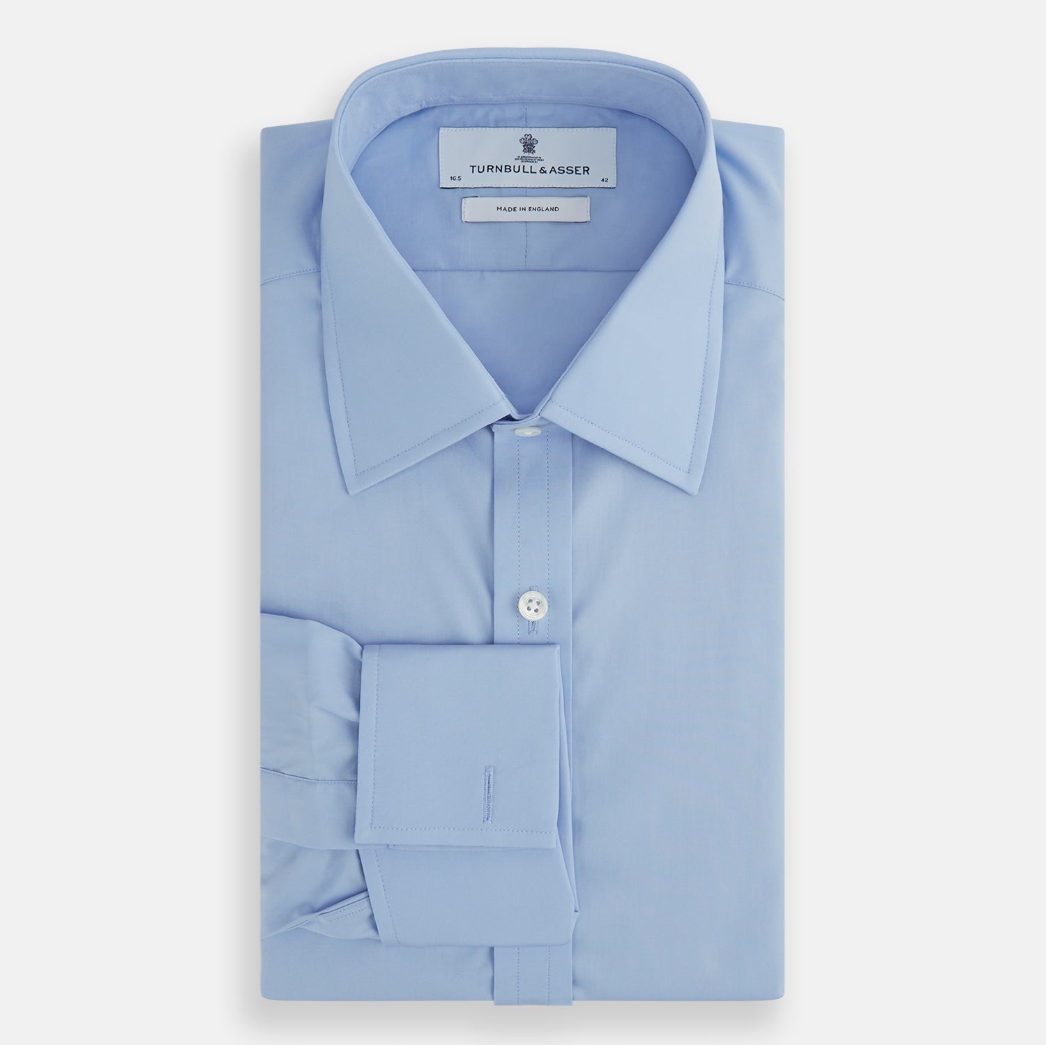 Image 5 of product The Turnbull & Asser Blue Cotton Shirt features a T&A collar, double cuffs, and white buttons—ideal for smart styling with a navy suit. Displayed on a white background.