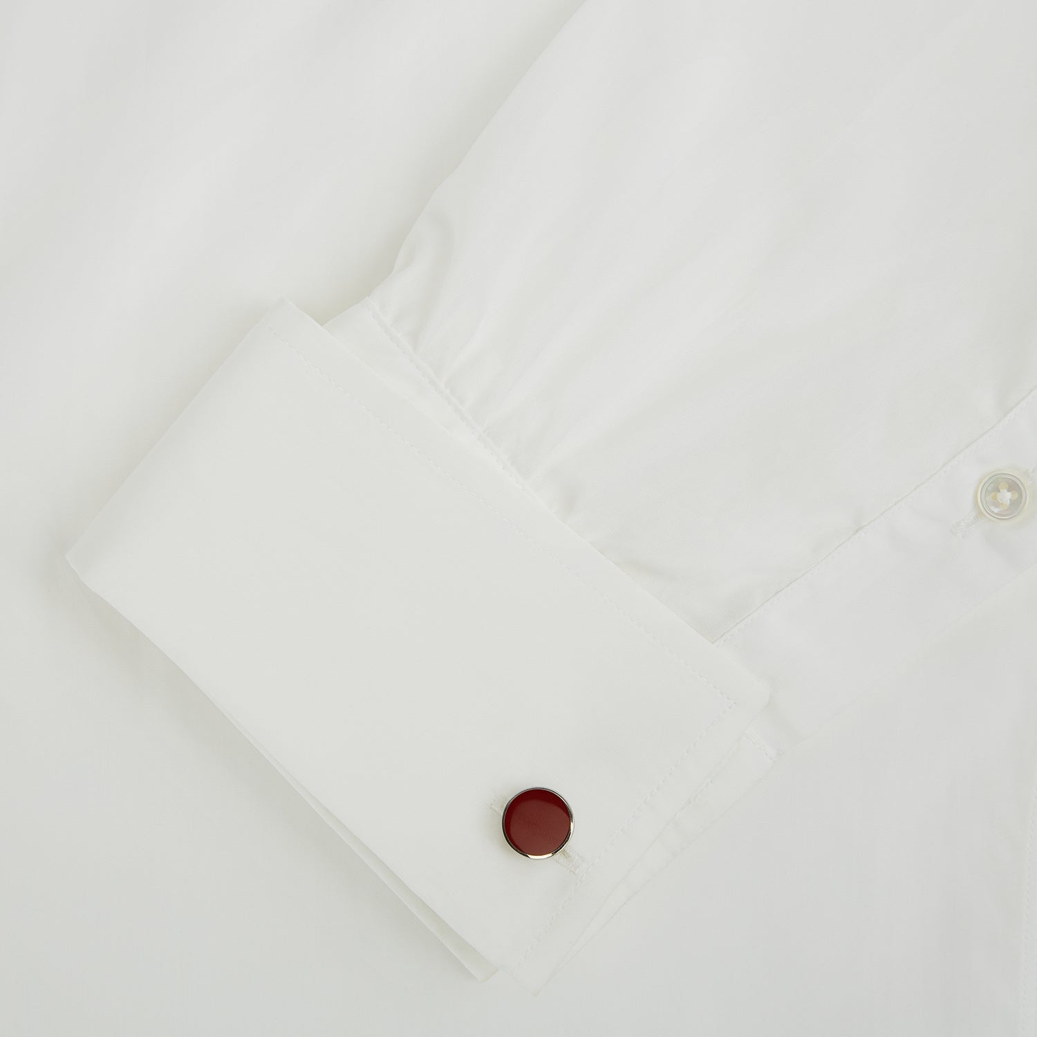 Image 3 of product Turnbull & Asser's Red Circle Cufflinks feature round sterling silver with bold red enamel centers, offering a refined accessory for gentlemen, shown on a white background.