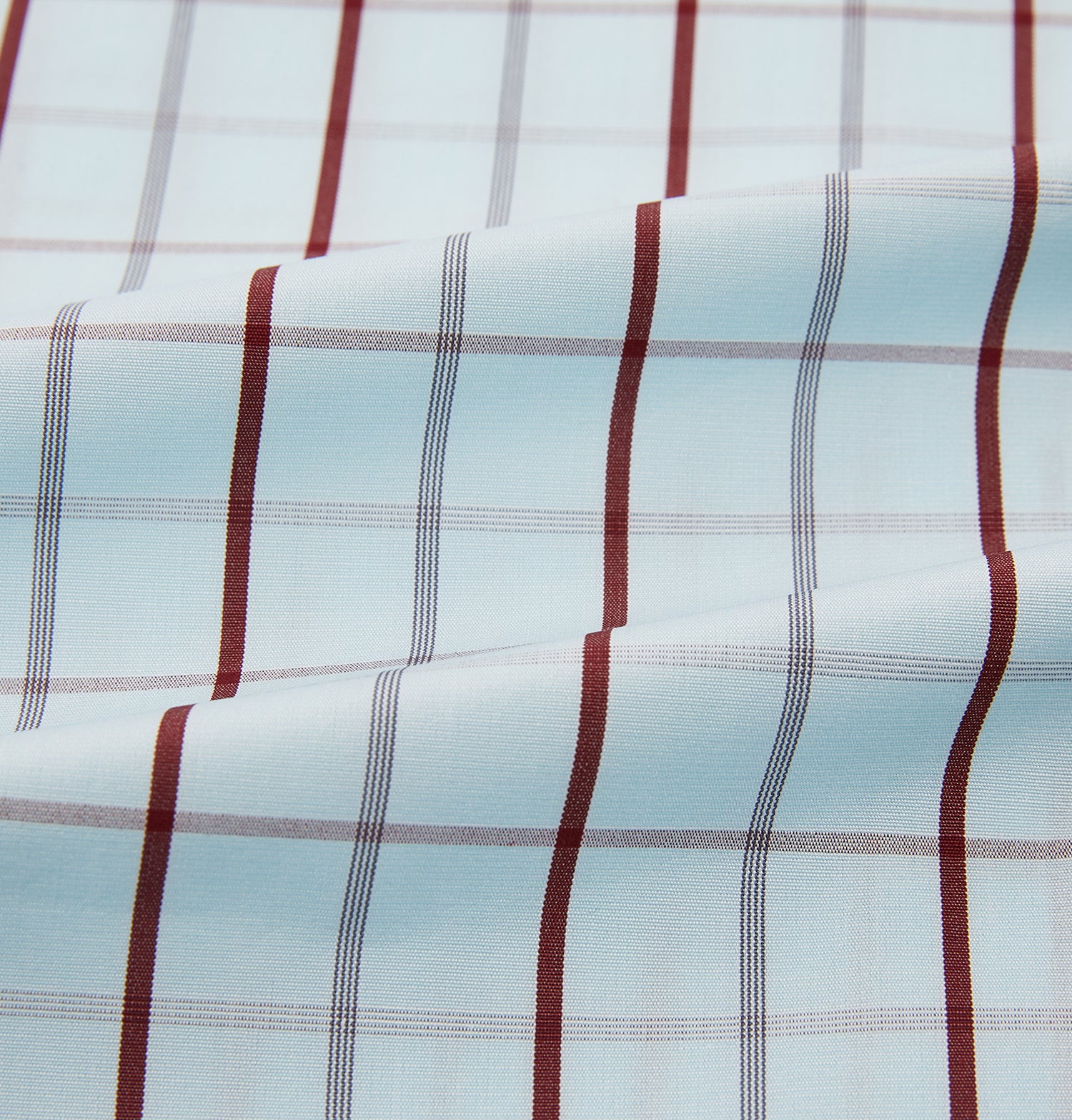 Image 6 of product The Turnbull & Asser Burgundy Combination Check Mayfair Shirt is a long-sleeve button-up dress shirt with a check pattern, ideal for formal wear and shown on a plain white background.