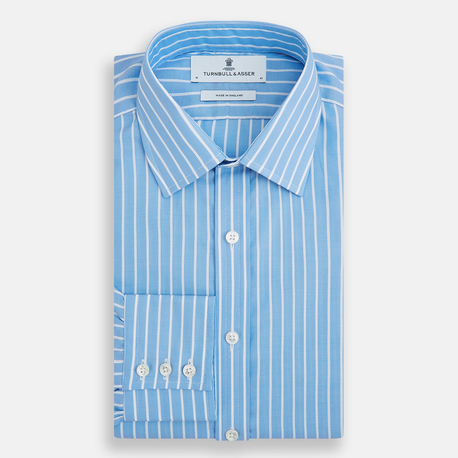 Image 5 of product The Turnbull & Asser Sky Blue Wide Pinstripe Mayfair Shirt features long sleeves, a classic collar, and buttoned cuffs, laid flat against a white background for a refined formal look.