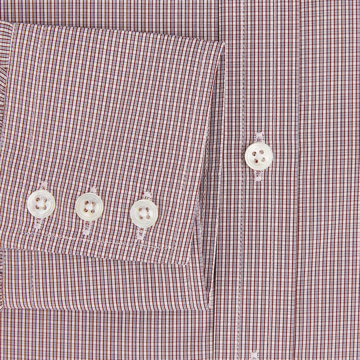 Image 4 of product The Turnbull & Asser Burgundy Micro Shadow Check Mayfair Shirt features long sleeves, a classic collar, and white buttons. In light red and white shades, this button-up is perfect for formal wear and is shown laid flat against a white background.