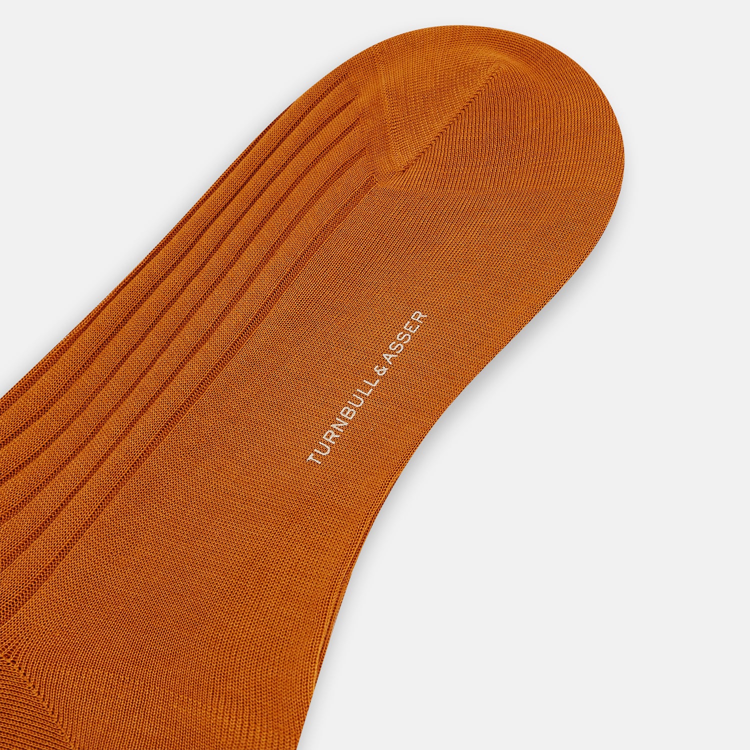 Image 3 of product The Pumpkin Mid-Length Sock by Turnbull & Asser, a single orange knee-high ribbed design, is shown upright against a plain white background.