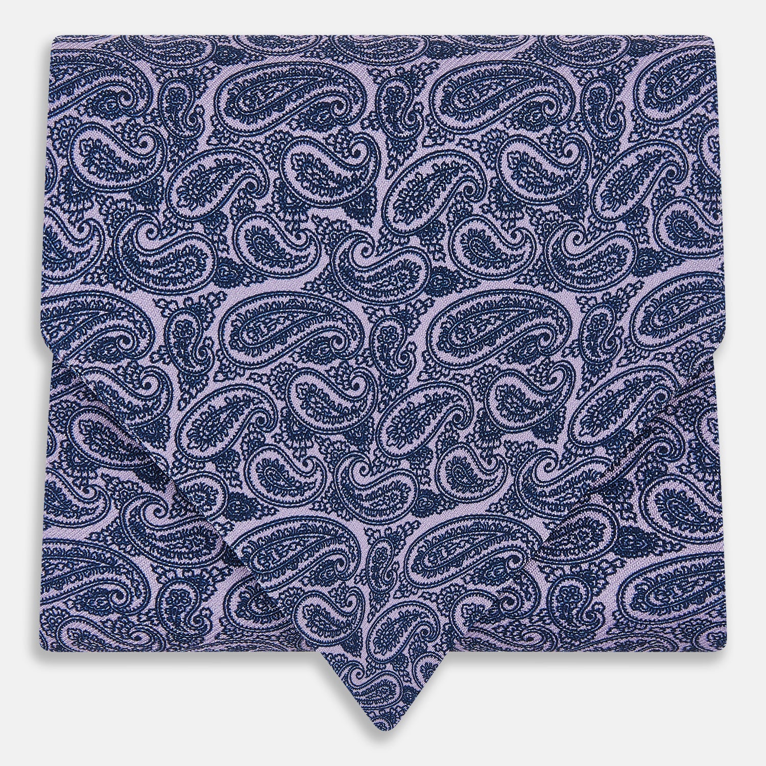 Image 1 of product The Turnbull & Asser Lilac Paisley Silk Cravat showcases British elegance with its dark blue paisley pattern on a lilac background, beautifully displayed on a white surface.