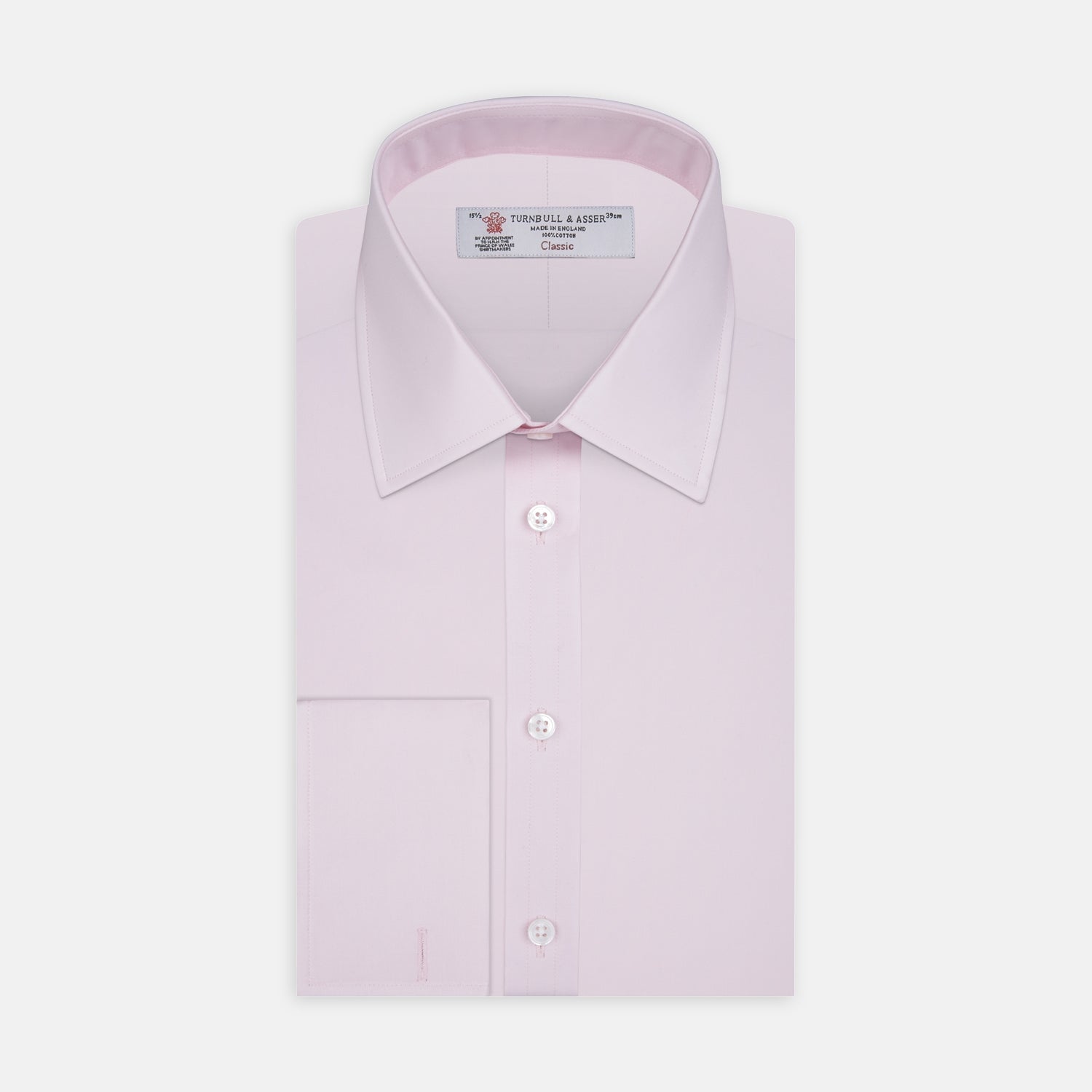 Image 1 of product A neatly folded Pink Cotton Shirt with T&A collar and double cuffs by Turnbull & Asser, featuring a classic design with white buttons and an inner label, displayed on a plain white background.