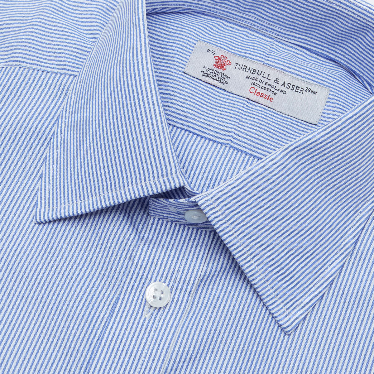 Image 2 of product The Turnbull & Asser Blue Fine Bengal Stripe Shirt features a classic T&A collar, 3-button cuffs, and white buttons, crafted from fine cotton and displayed against a crisp white background.