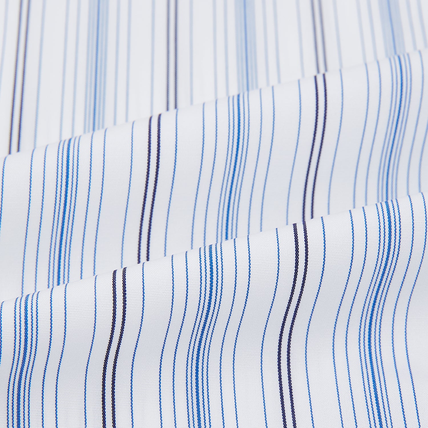 Image 6 of product The Turnbull & Asser Navy and Blue Multi Stripe Shirt with Contrast Collar and Double Cuffs is shown in a Mayfair fit on a plain white background.