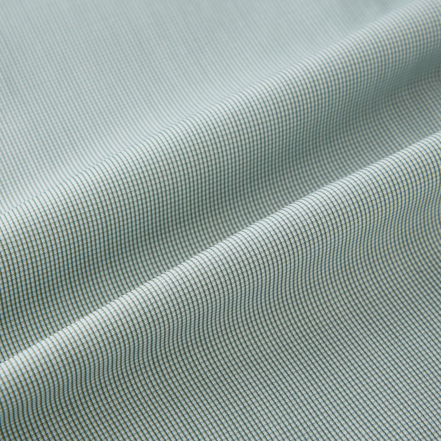 Image 8 of product A dark green micro graph check Westminster shirt by Turnbull & Asser, featuring fine British craftsmanship, a Turnbull collar, and white buttons, is laid flat on a white background.
