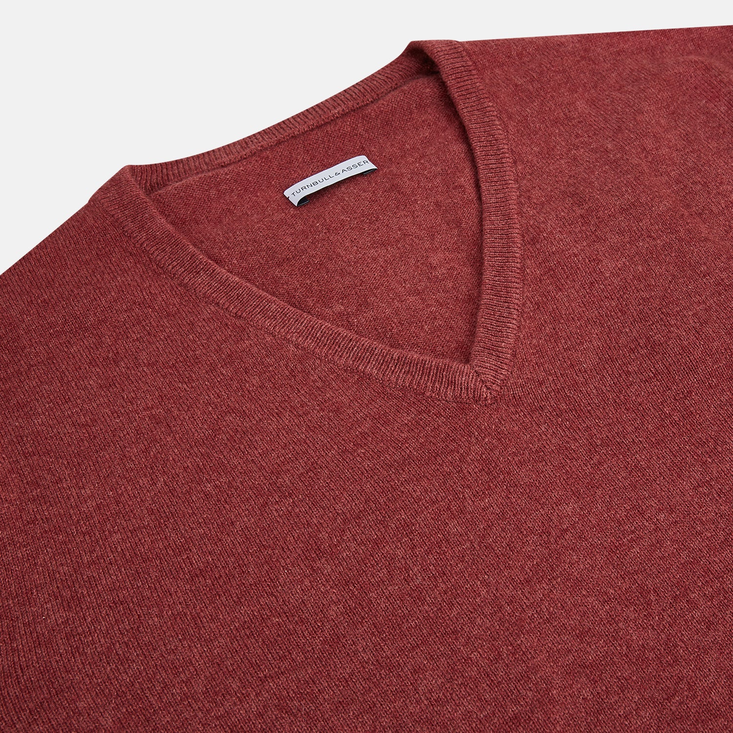 Image 2 of product The Turnbull & Asser Burgundy Crew V-Neck Cashmere Jumper is a long-sleeve knitwear piece with ribbed cuffs, hem, and neckline, shown on a white background.
