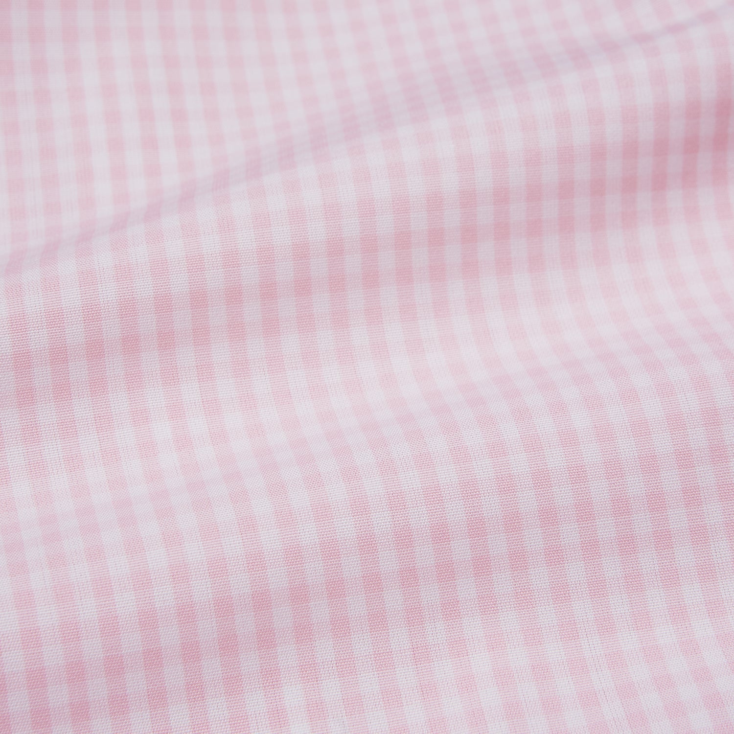 Image 5 of product The Pink Windowpane Check Mayfair Shirt by Turnbull & Asser is crafted in light pink organic cotton with a subtle windowpane check, button-down front, and pointed collar, displayed flat on a white background.
