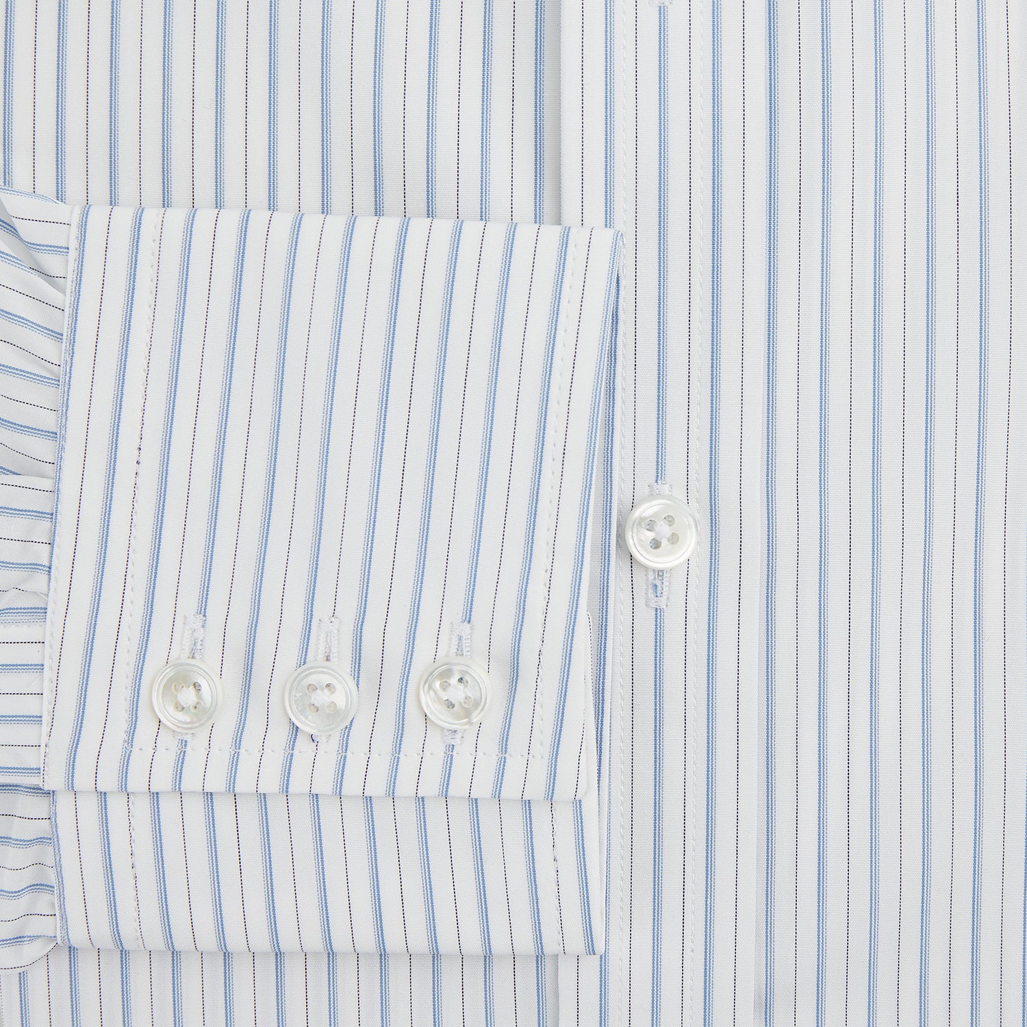 Image 4 of product The Turnbull & Asser Sky Blue Combination Stripe Mayfair Shirt features long sleeves, a T&A collar, buttoned cuffs, and thin vertical stripes in blue, shown on a plain white background.