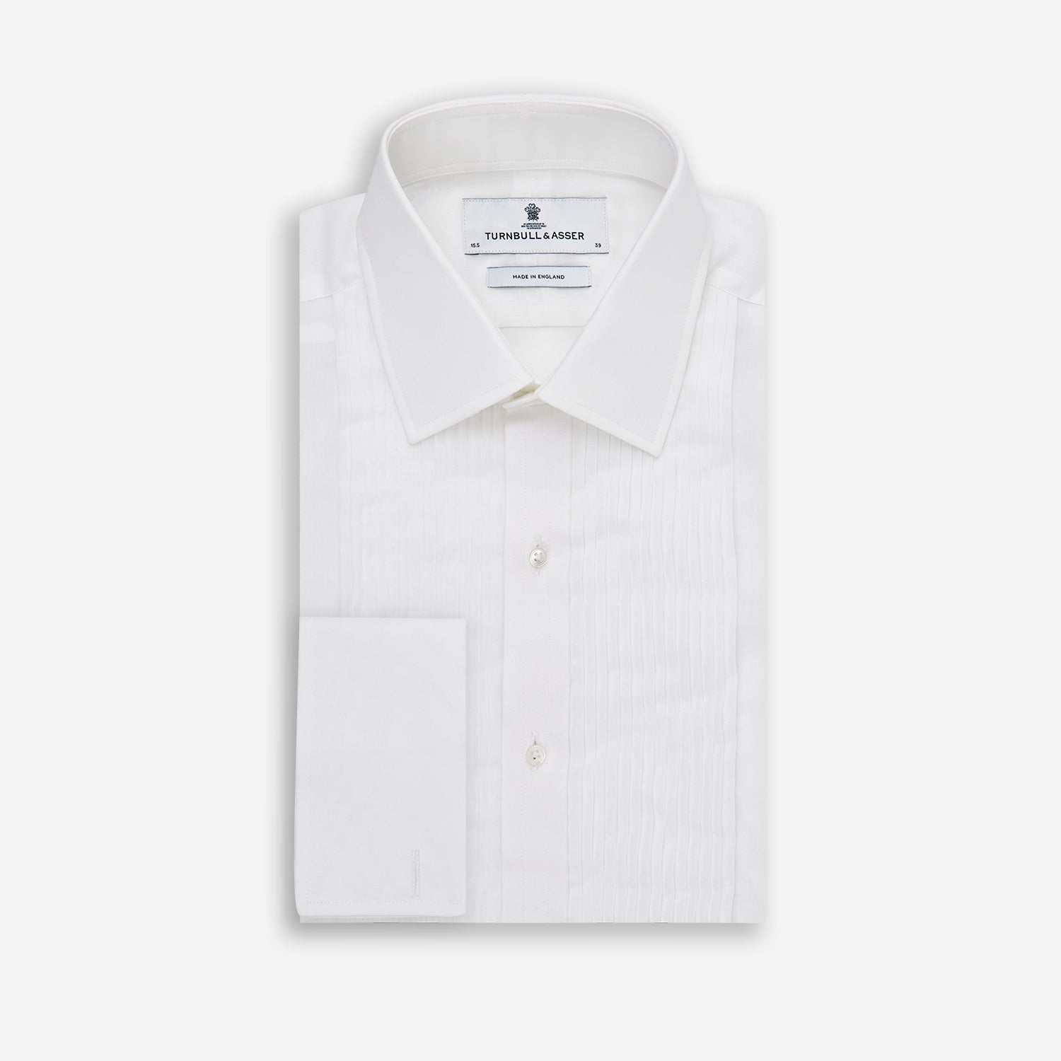 Image 6 of product The Die Another Day Inspired Voile Dress Shirt by Turnbull & Asser features a white pleated front, button-down closure, and classic collar—laid flat on white to showcase its timeless James Bond style.