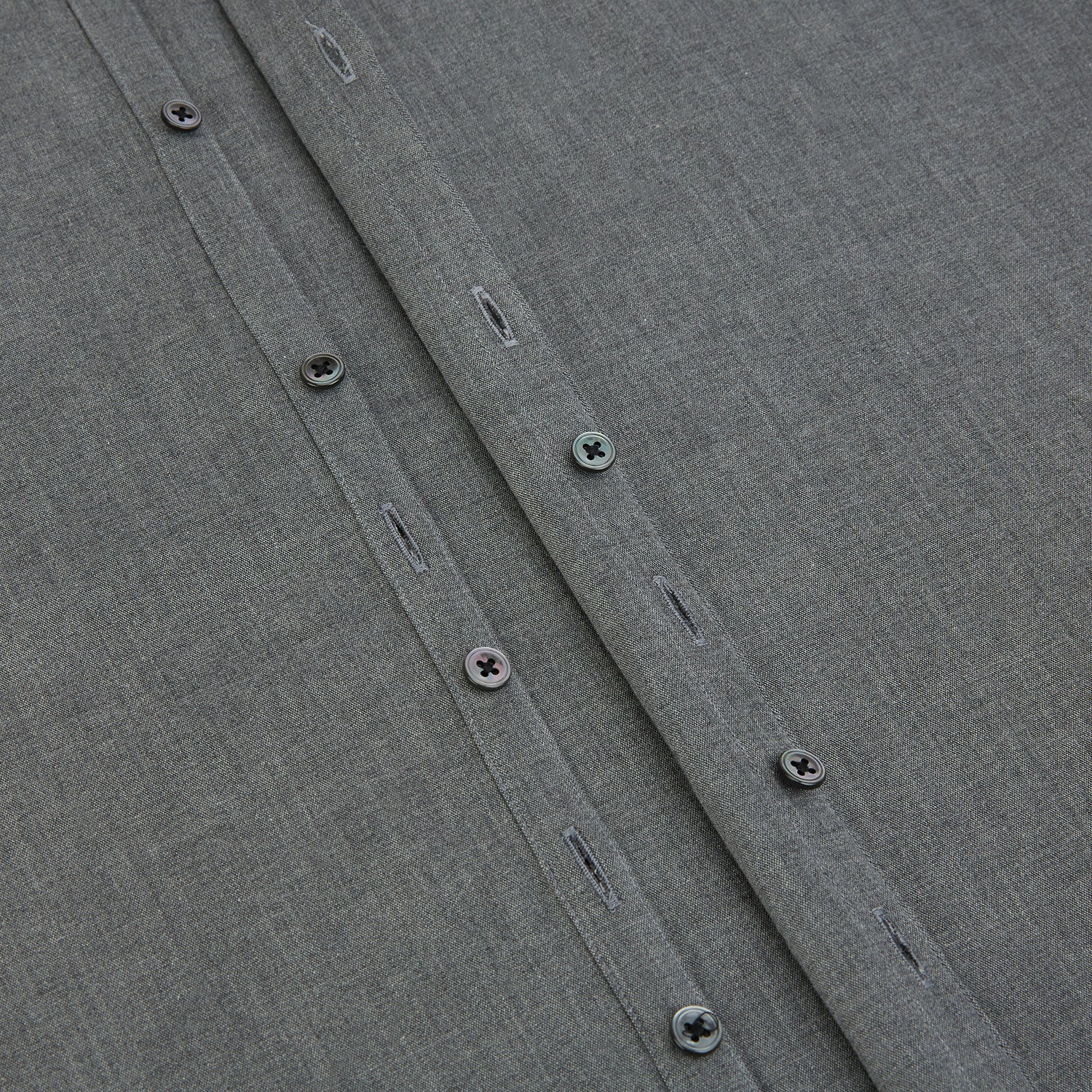 Image 7 of product The Pale Charcoal Westminster Shirt by Turnbull & Asser features British craftsmanship with a tailored silhouette, long sleeves, pointed collar, buttoned cuffs, and a solid pale charcoal hue, elegantly shown against a white background.