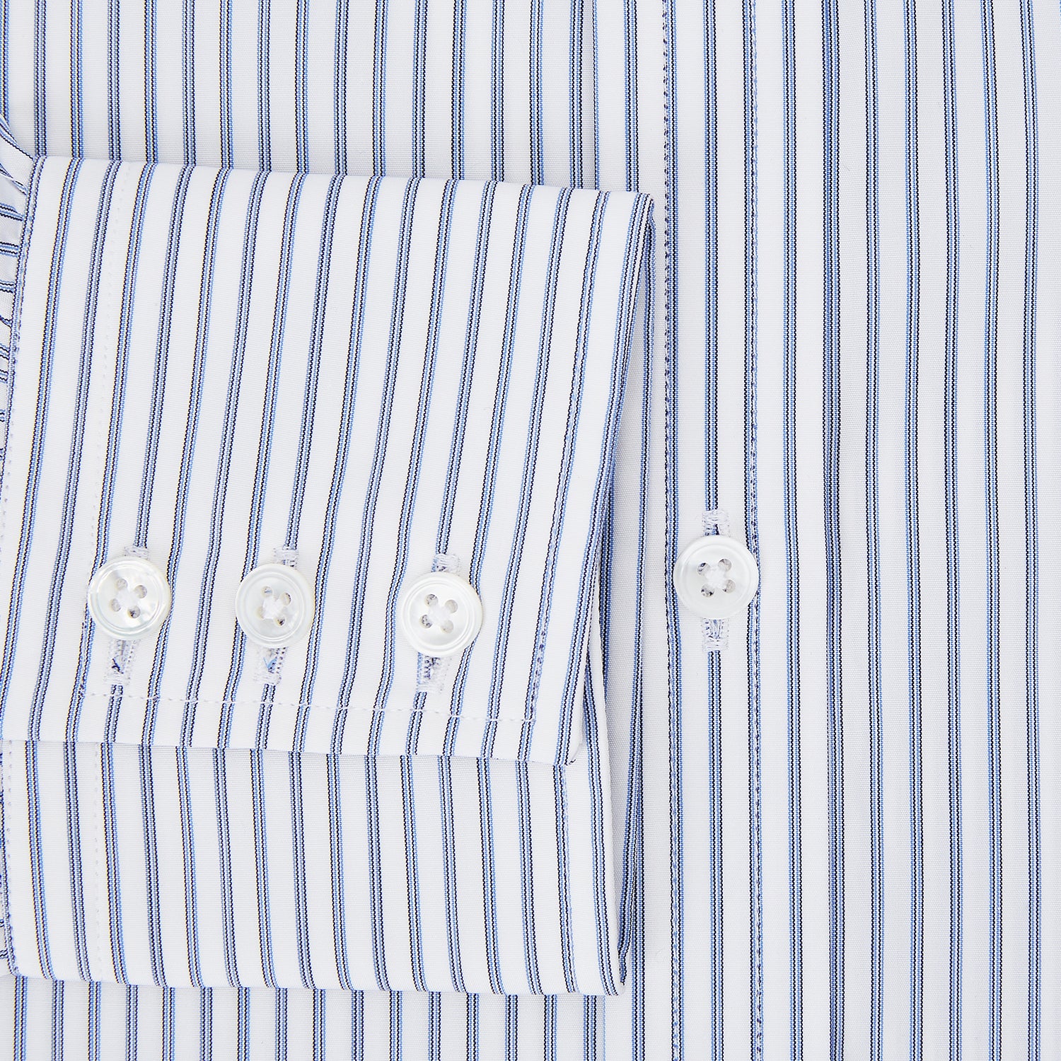 Image 4 of product The Turnbull & Asser Navy Double Pinstripe Mayfair Shirt is a long-sleeve, button-up collared shirt with thin vertical blue and white stripes, shown against a plain white background.