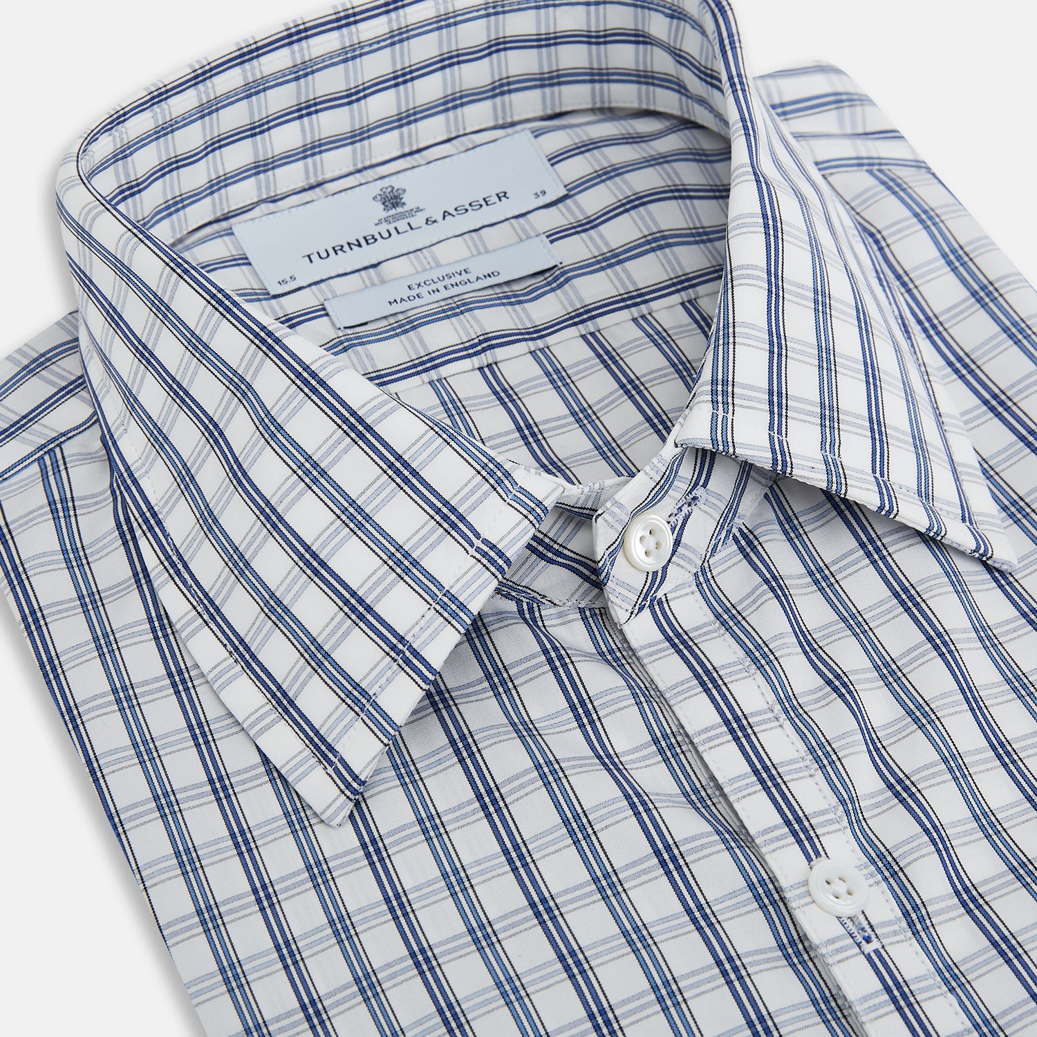 Image 2 of product The Azzurro Multi Check Westminster Shirt by Turnbull & Asser is a long-sleeve, button-up with a white base and blue and gray checks, displayed flat against a white background.