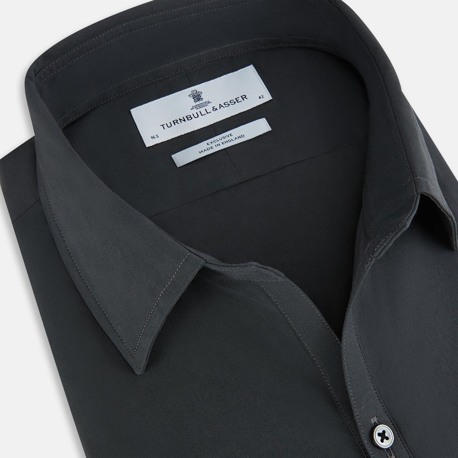 Image 2 of product The CHARCOAL WINDSOR SHIRT by Turnbull & Asser, featuring long sleeves, a button-up front, and a pointed collar, is displayed flat against a white background, reflecting classic British craftsmanship.