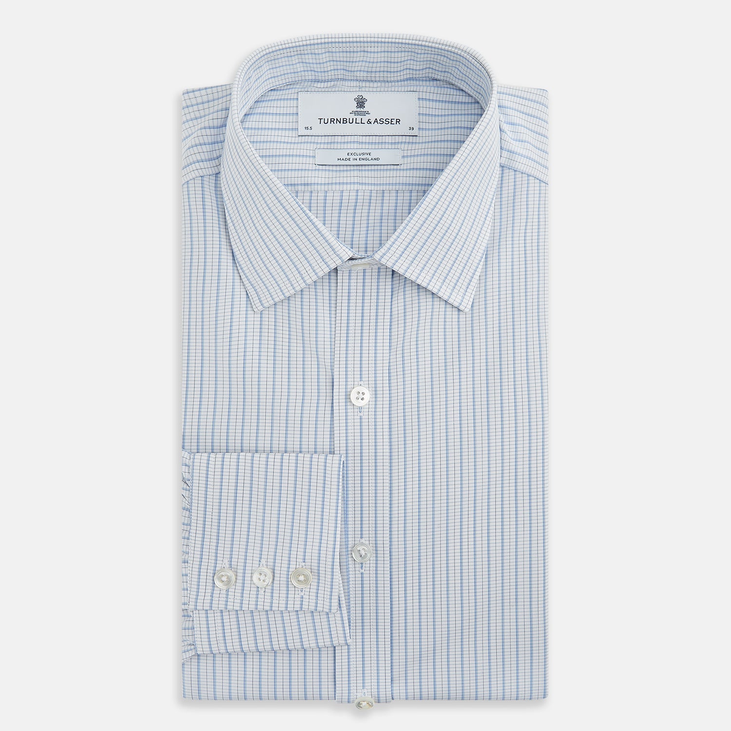 Image 5 of product The Turnbull & Asser Blue Graph Check Mayfair Shirt features a classic T&A collar, Mayfair fit, buttoned cuffs, and long sleeves with light blue graph checks on a white background.