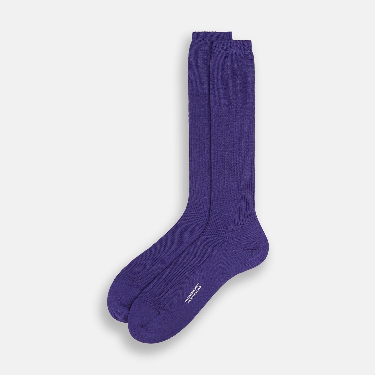 Image 2 of product The Turnbull & Asser Violet Mid-Length Merino Socks, crafted from luxurious merino wool, feature a knee-high ribbed design and are shown upright against a plain white background.