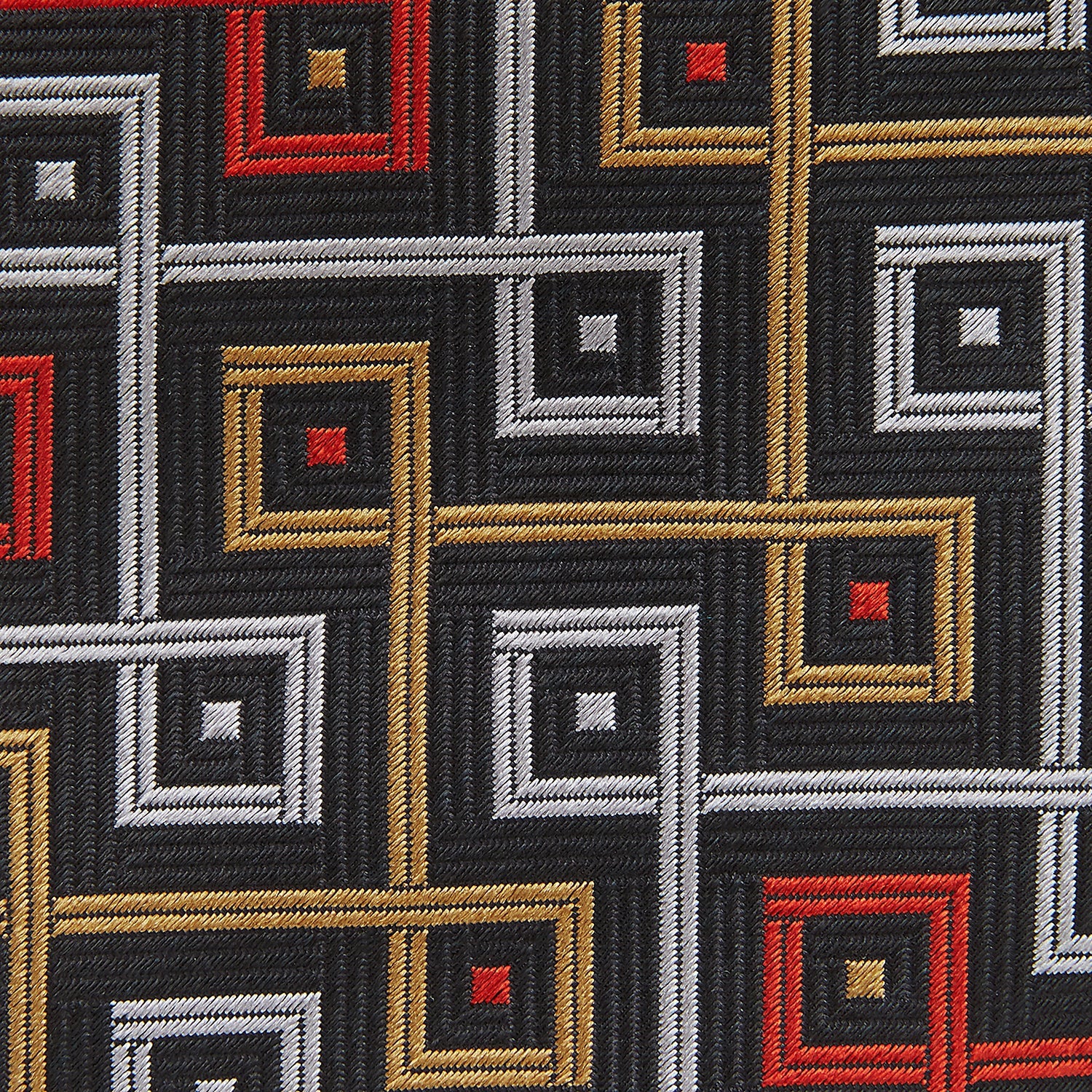 Image 4 of product The Turnbull & Asser "The World Is Not Enough" Square Silk Tie, as seen on James Bond, features a geometric diamond pattern in black, red, yellow, and white on gray—an ideal stylish gift for any Bond fan.