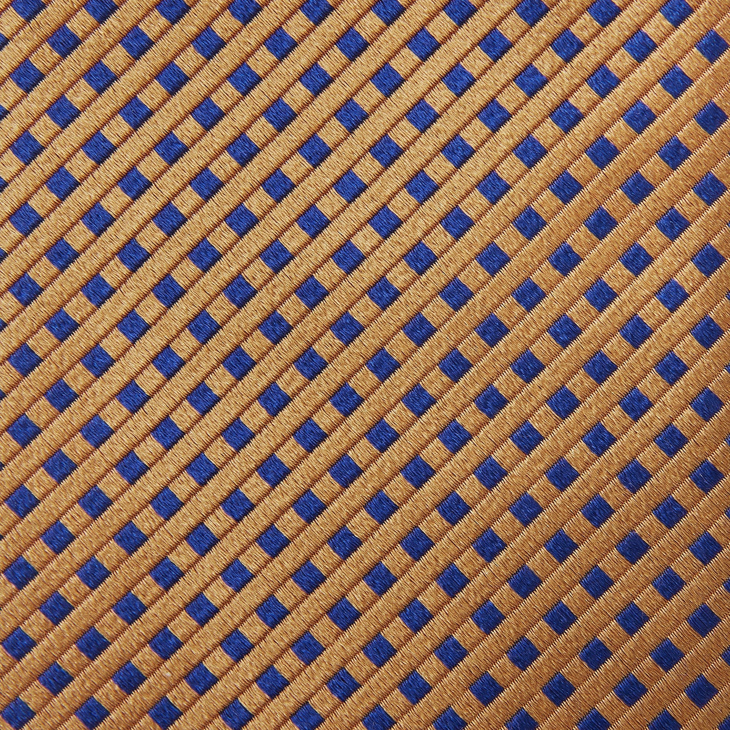 Image 4 of product The Turnbull & Asser Tomorrow Never Dies Diamond Silk Tie, as seen on James Bond, features a gold and navy checkered pattern—an ideal gift for any Bond fan. Displayed rolled against a plain white background.