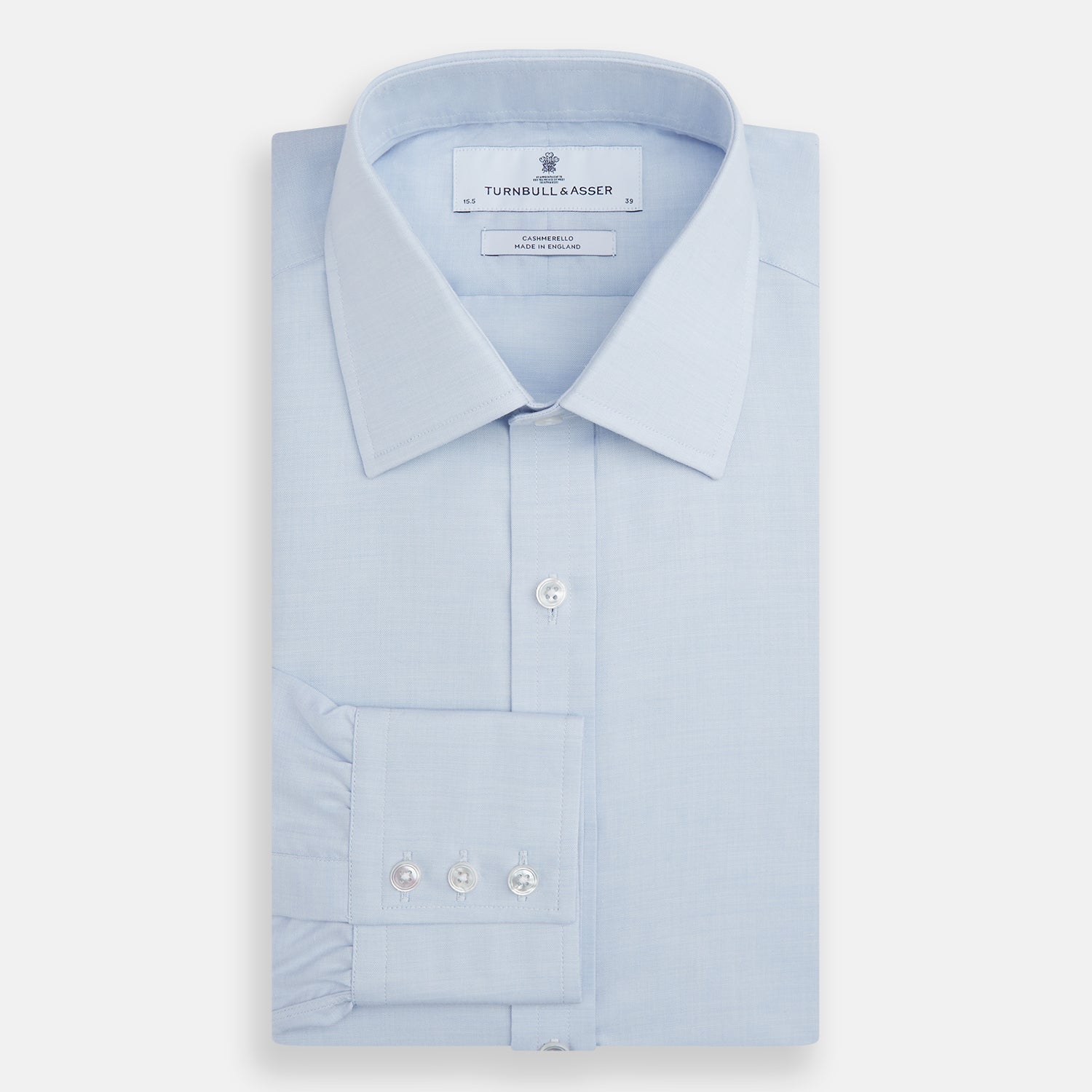 Image 4 of product The Turnbull & Asser Blue Cashmerello Mayfair Shirt is a light blue cotton-cashmere blend with long sleeves, pointed collar, white buttons, and buttoned cuffs, shown on a plain white background.
