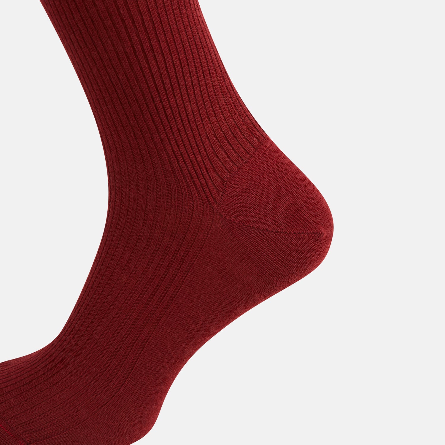 Image 4 of product A single Burgundy Mid-Length Merino Sock by Turnbull & Asser, ribbed and crafted from soft merino wool, is displayed upright against a plain white background.