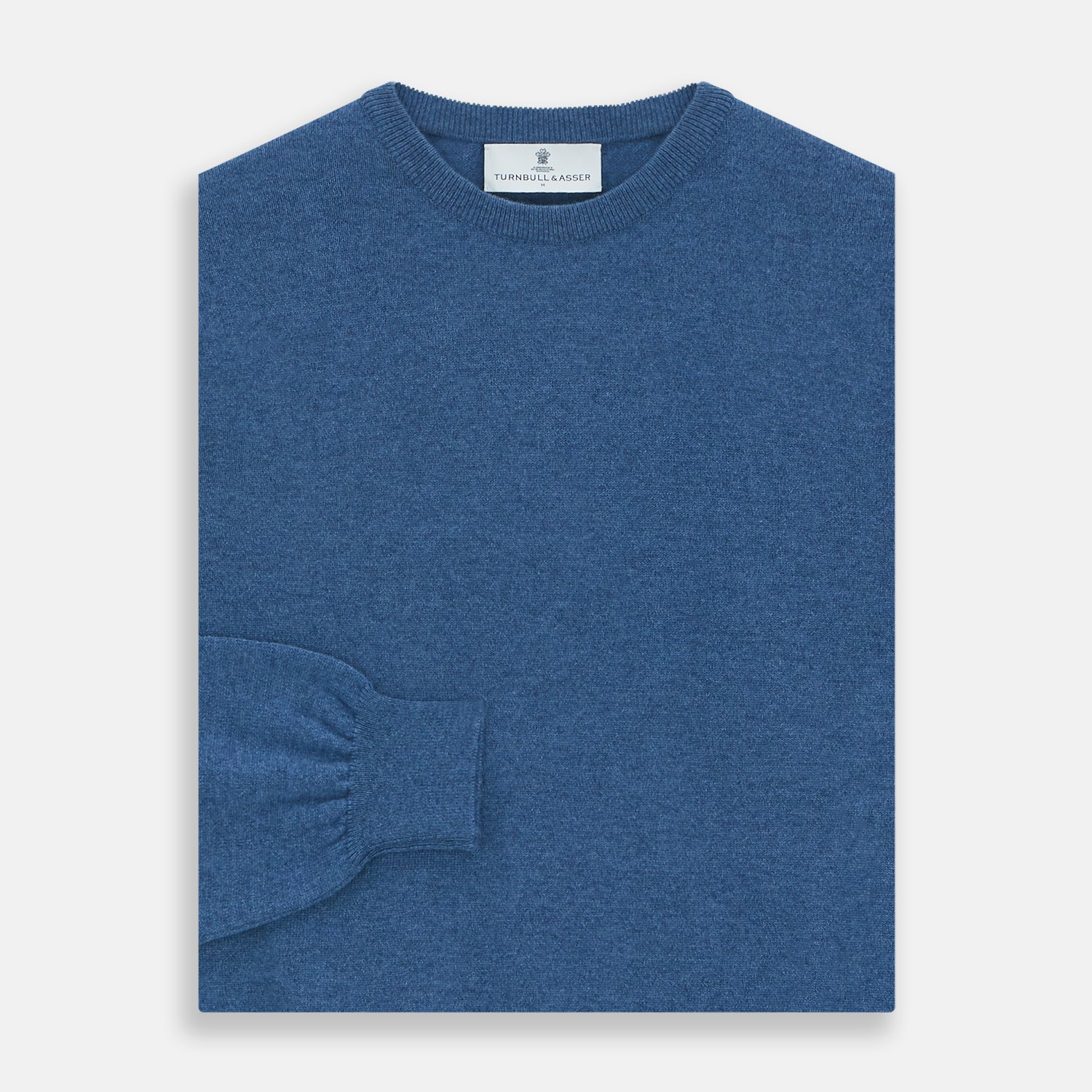 Image 3 of product The Turnbull & Asser Blue Crew Neck Cashmere Jumper is laid flat on a white background, showcasing ribbed cuffs, hem, and neckline for an elegant, smart-casual style.