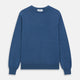 The Turnbull & Asser Blue Crew Neck Cashmere Jumper is laid flat on a white background, showcasing ribbed cuffs, hem, and neckline for an elegant, smart-casual style.