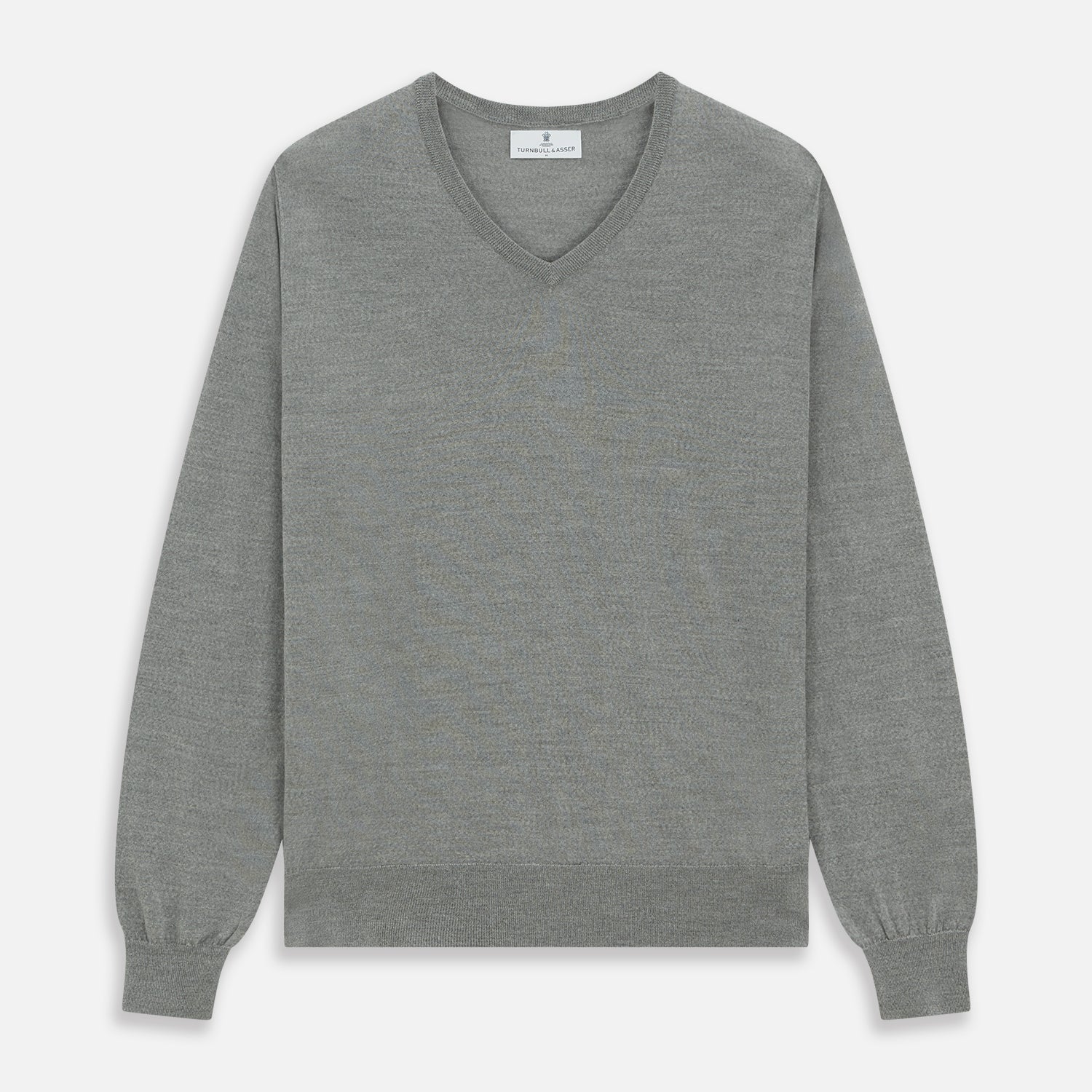 Image 1 of product The Grey V-Neck Merino Wool Jumper by Turnbull & Asser features long sleeves with ribbed cuffs and hem, making it a versatile wardrobe essential for any gentleman. Shown here in classic light grey on a white background.