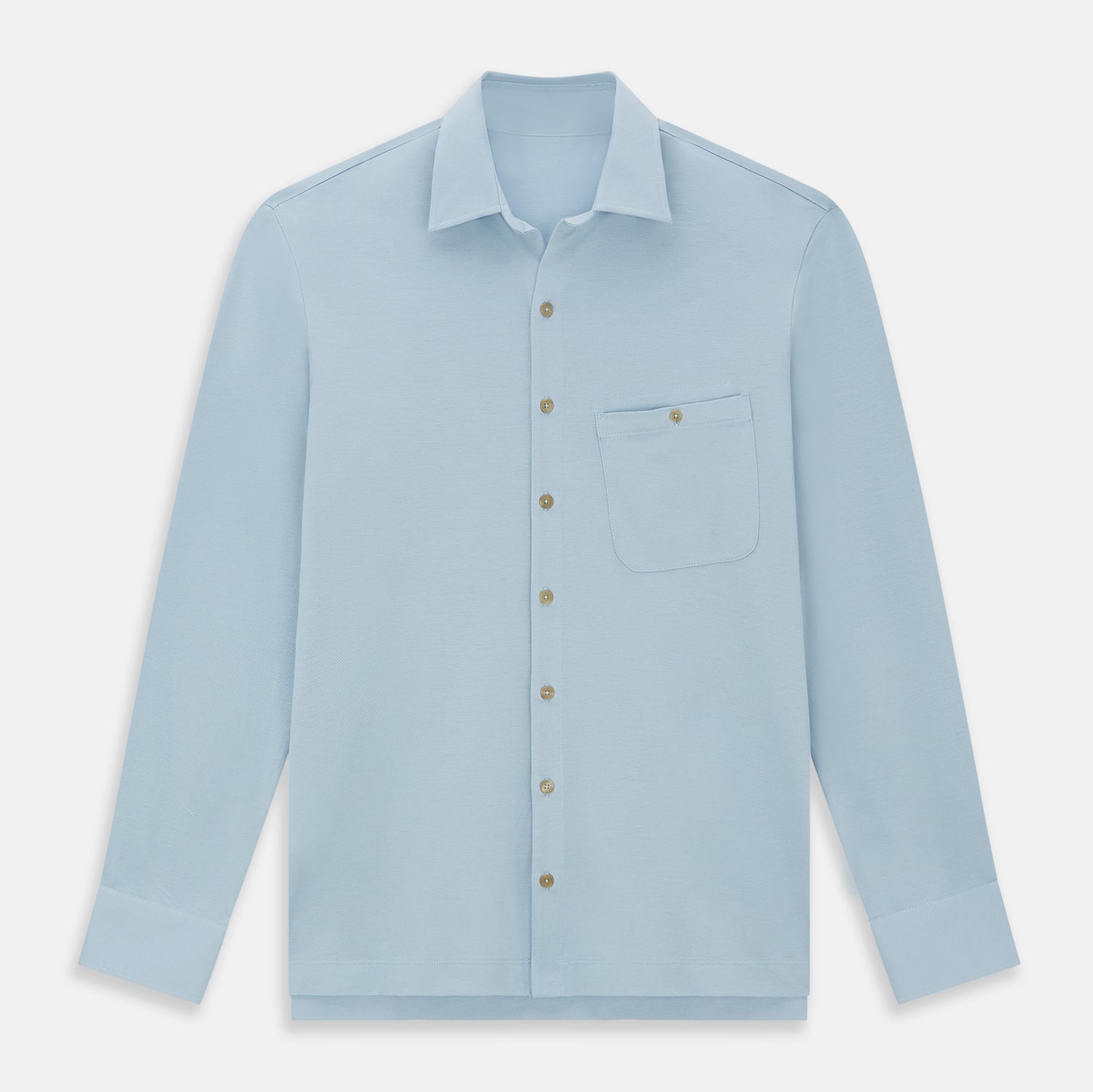 Image 1 of product The Turnbull & Asser Pale Blue Pique Shirt is a long-sleeve button-up with an open collar, single chest pocket, and beige buttons, shown against a white background.