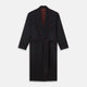 The Navy and Red Piped Cashmere Gown by Turnbull & Asser features a belted navy silhouette with red contrast piping, wide lapels, chest pocket, and two side pockets, shown on a plain white background.