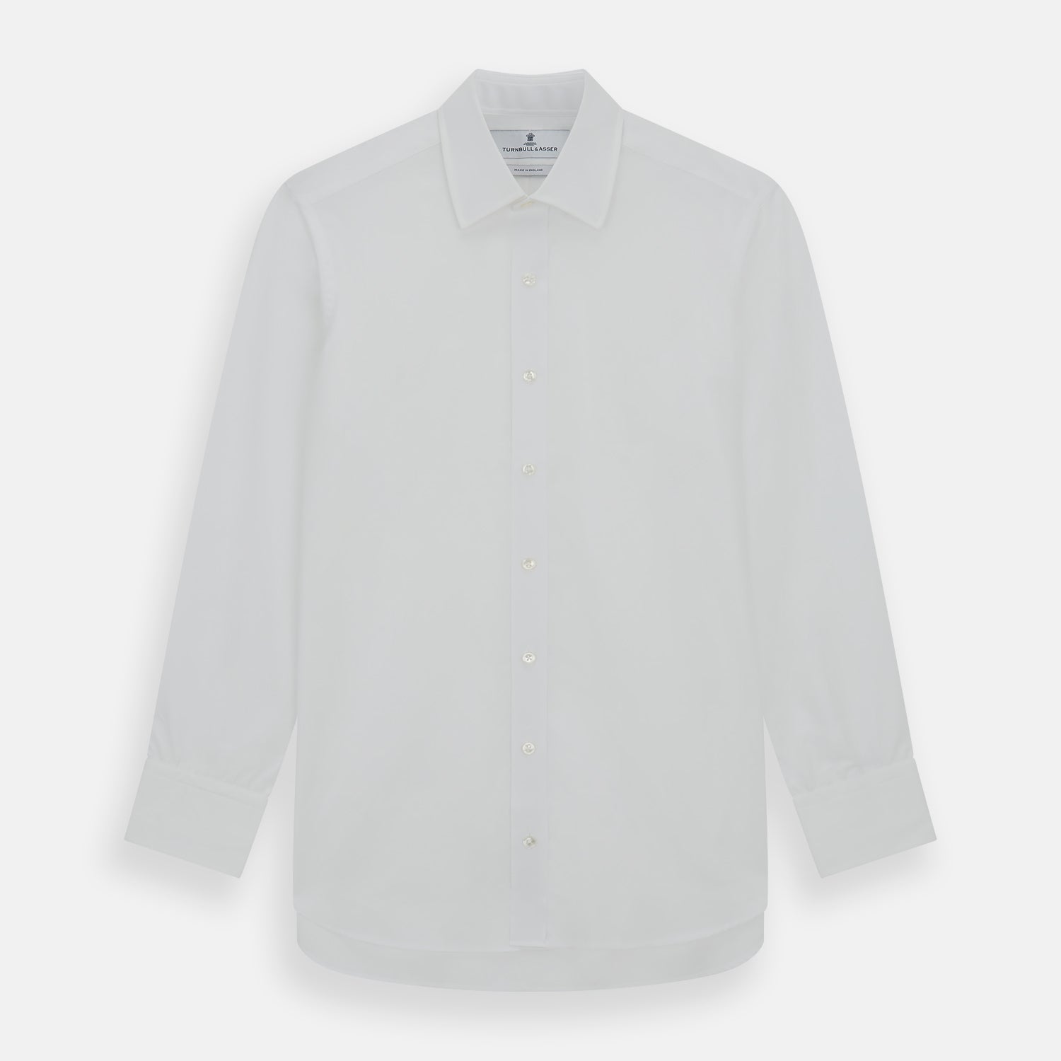 Image 1 of product The Turnbull & Asser Plain White Cotton Shirt features a stylish T&A collar and 3-button cuffs, ideal for minimalist outfits or statement ties, shown against a simple white background.