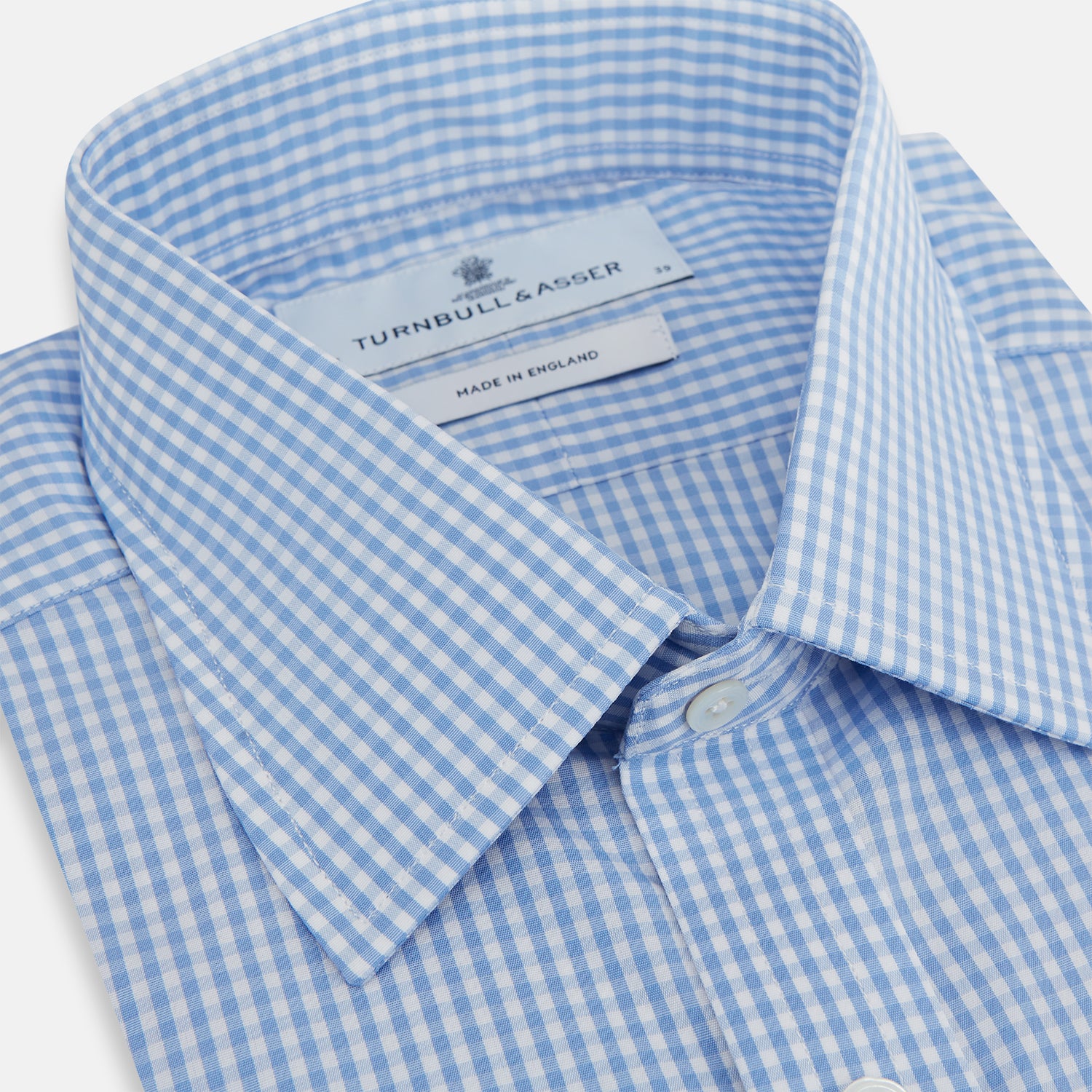 Image 2 of product The Turnbull & Asser Light Blue Gingham Check Shirt features a T&A collar, 3-button cuffs, and white buttons down the front.
