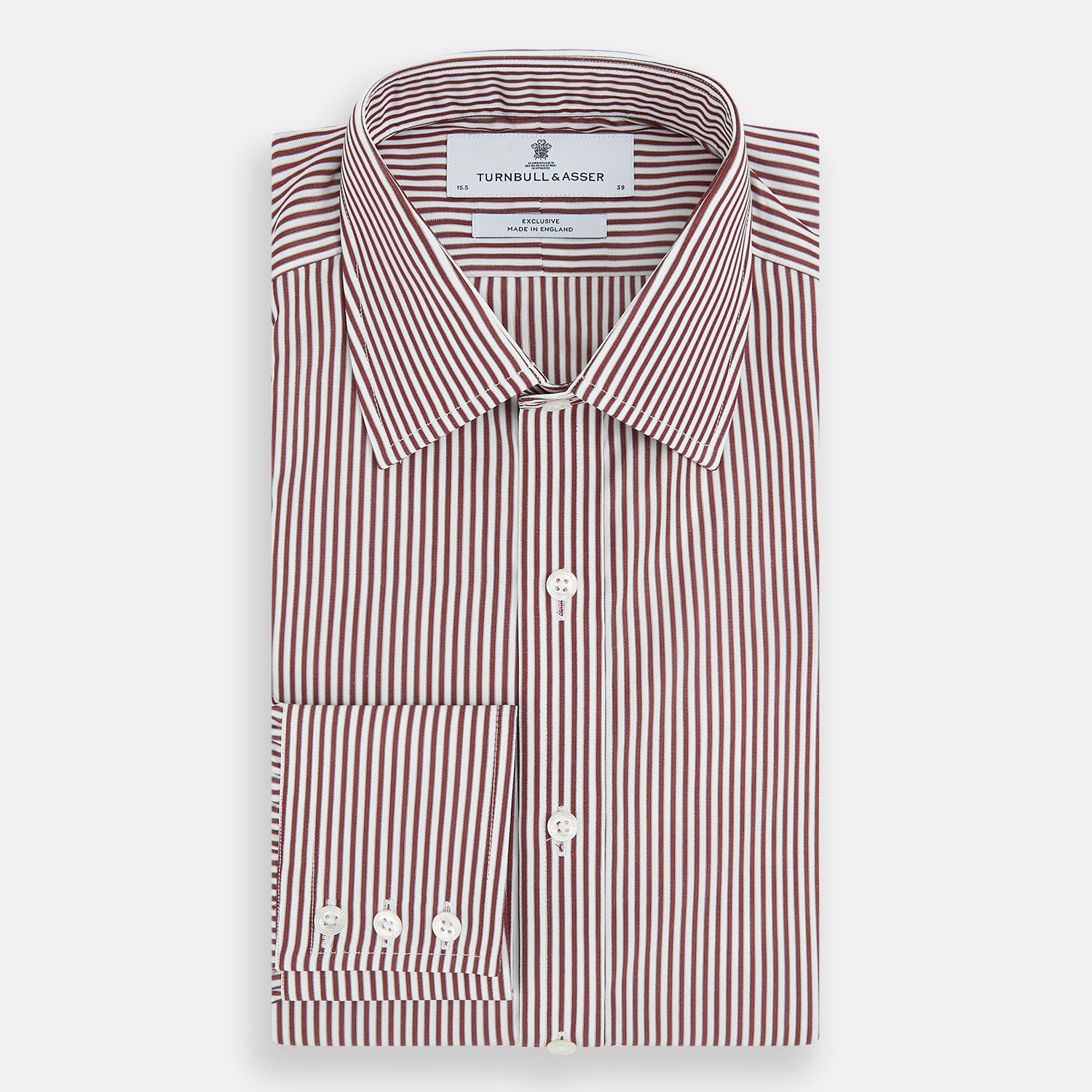 Image 5 of product The Turnbull & Asser Burgundy Halo Stripe Winston Shirt features long sleeves, a classic T&A collar, buttoned cuffs, narrow vertical burgundy and white stripes, and is crafted from organic cotton. Displayed on a white background.