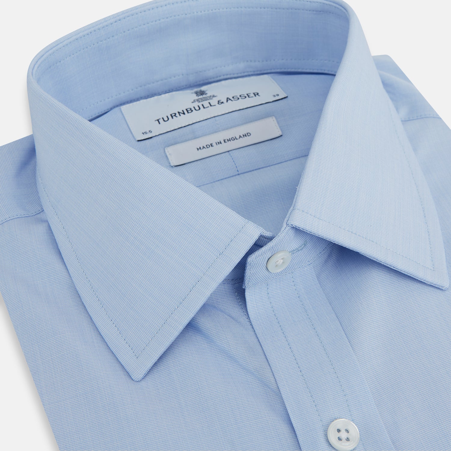 Image 2 of product The Turnbull & Asser Light Blue End-on-End Shirt, featuring a T&A collar and 3-button cuffs, is laid flat on a white background—perfect for smart looks or complementing your favorite navy suit.
