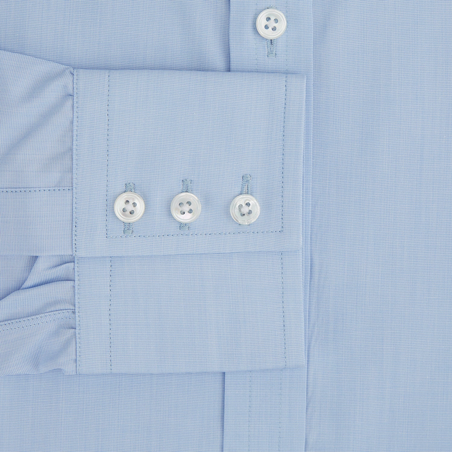 Image 3 of product The Turnbull & Asser Light Blue End-on-End Shirt, featuring a T&A collar and 3-button cuffs, is laid flat on a white background—perfect for smart looks or complementing your favorite navy suit.
