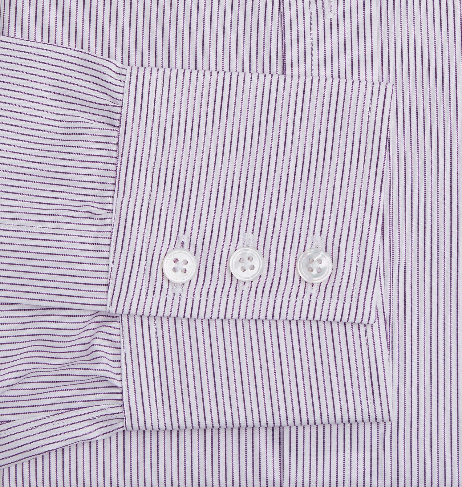 Image 3 of product The Purple Pinstripe Mayfair Shirt by Turnbull & Asser is a light purple cotton poplin long-sleeve button-up with white stripes, a pointed collar, white buttons, and cuffed sleeves, shown laid flat on a white background.